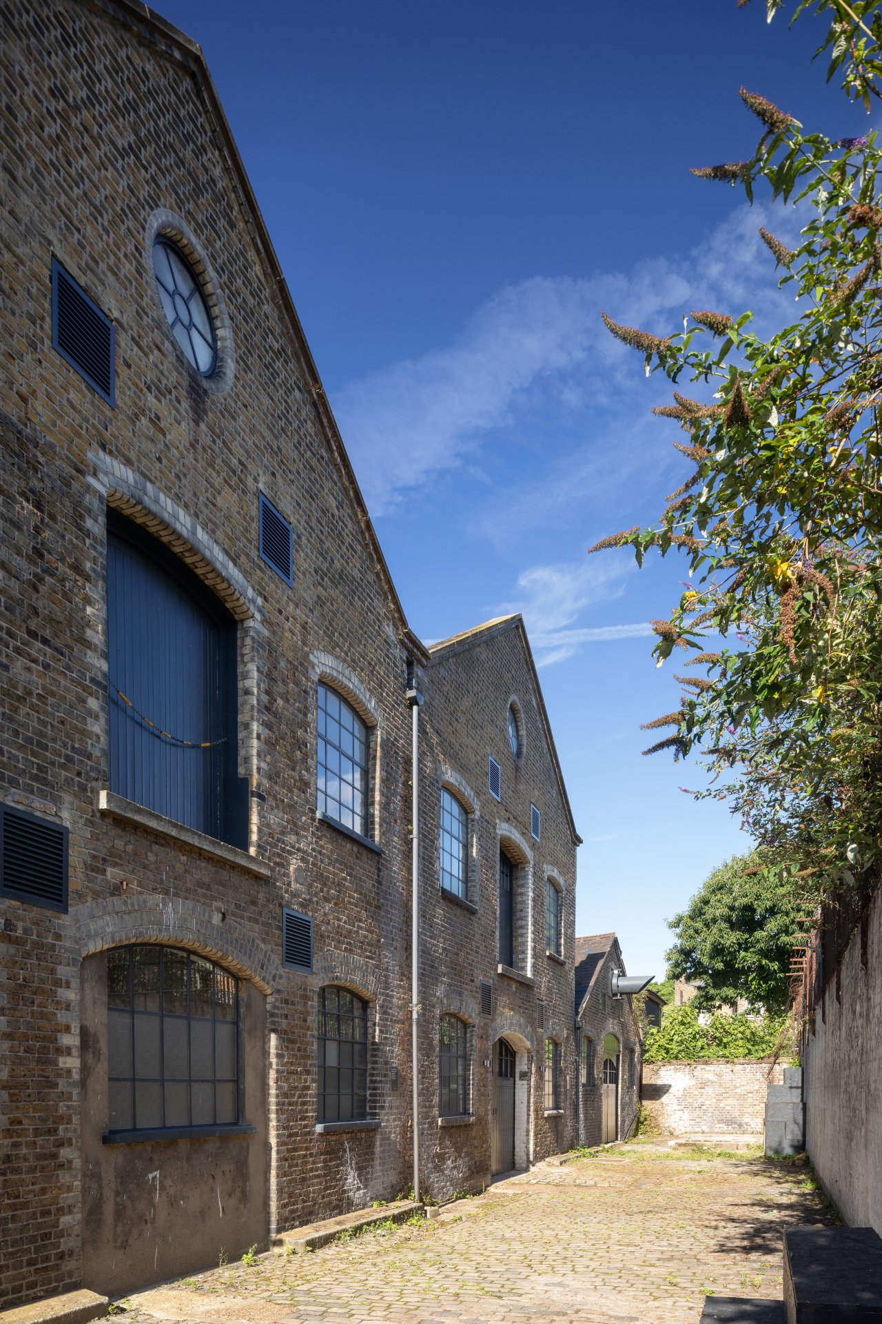 Charming brick building at The Bottle Factory, perfect for meetings and events.