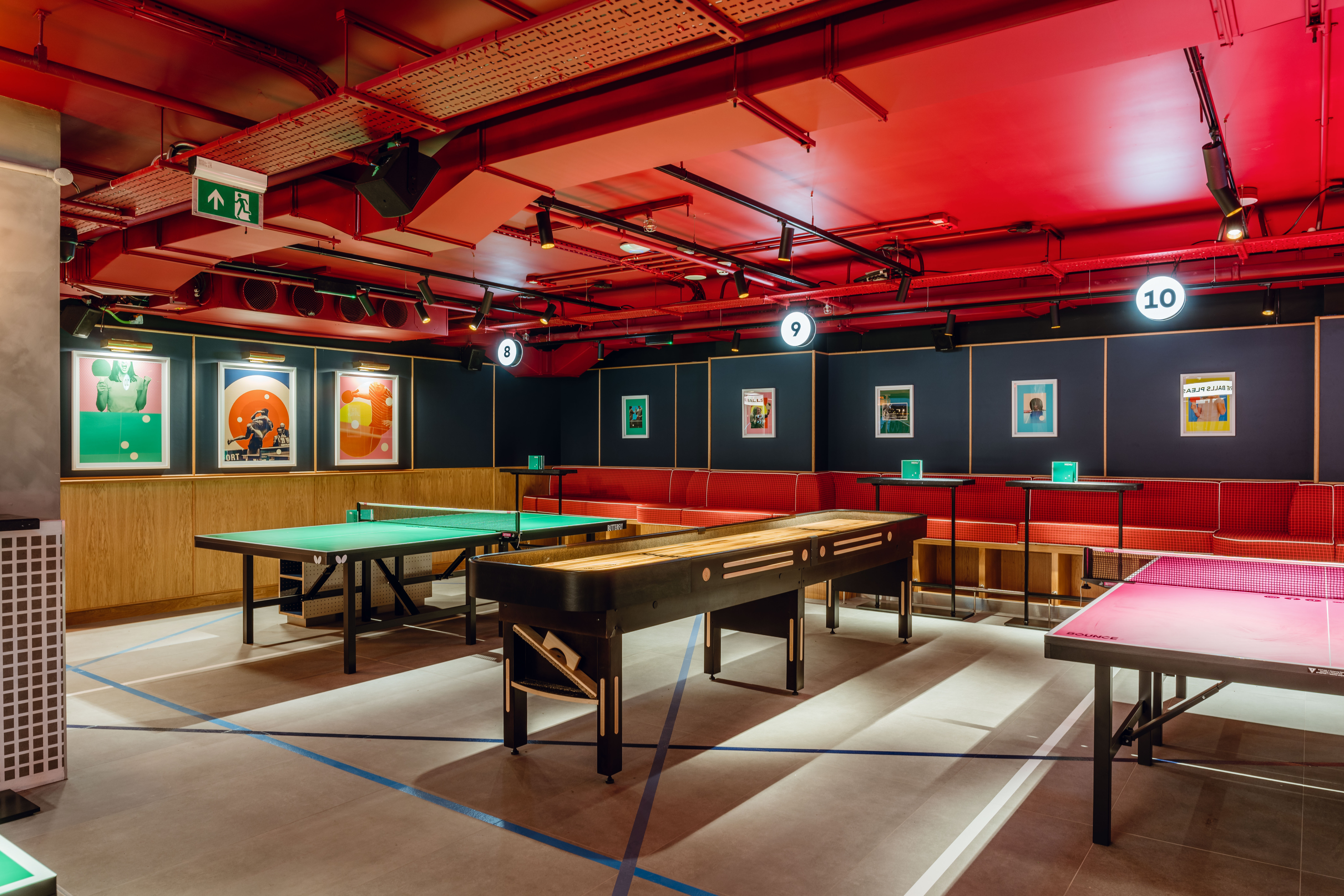 Vibrant event space at Bounce Battersea with game tables for team-building activities.