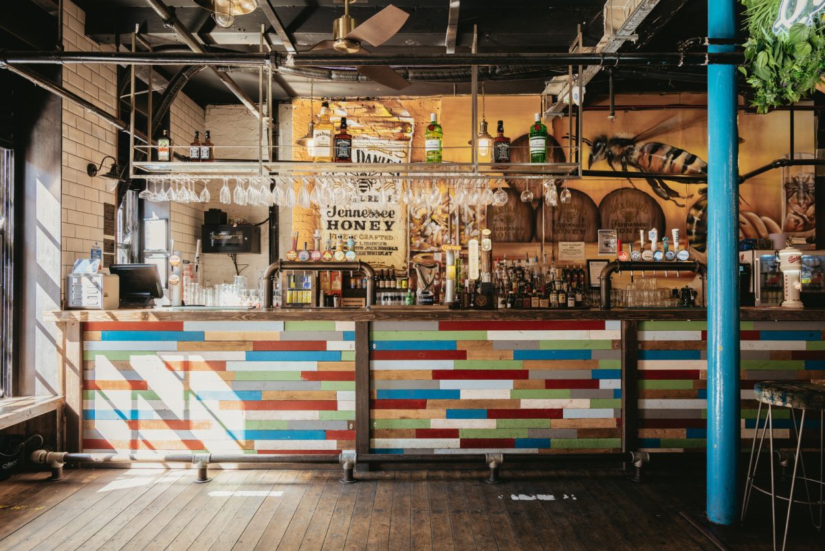 BBQ area in Quarter House with colorful paneling, ideal for social events and gatherings