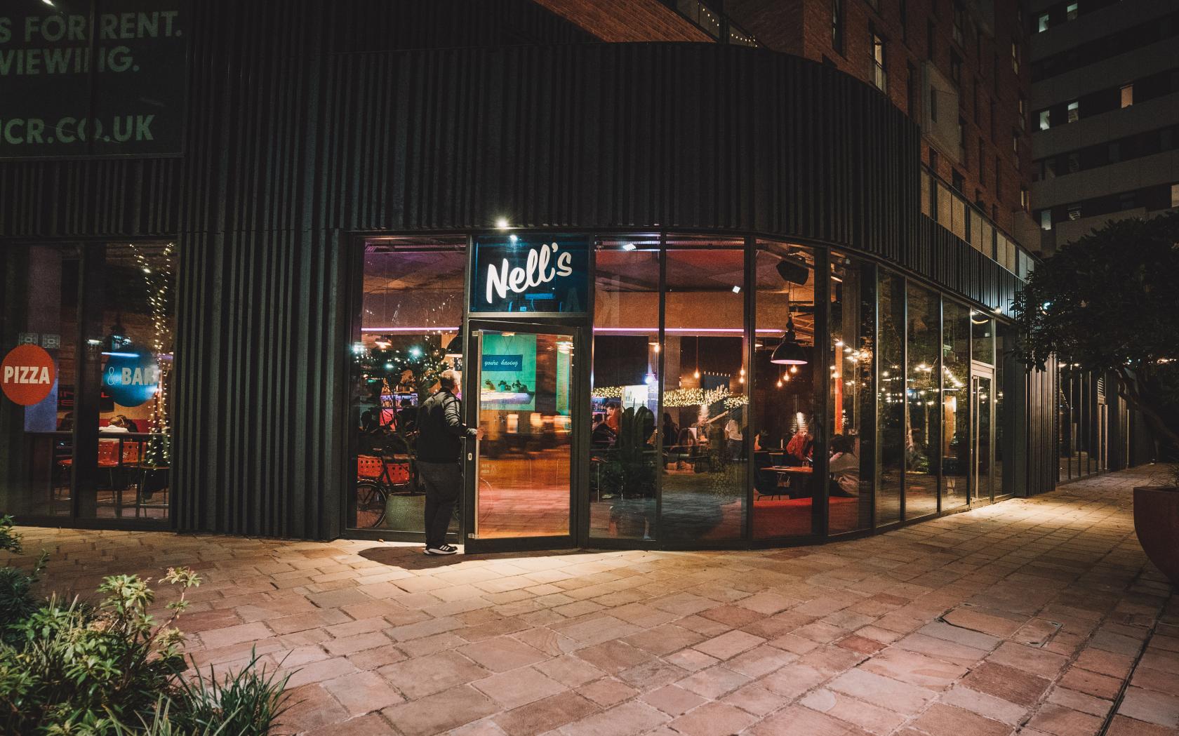 Vibrant bar with large glass windows, ideal for social gatherings and networking events.