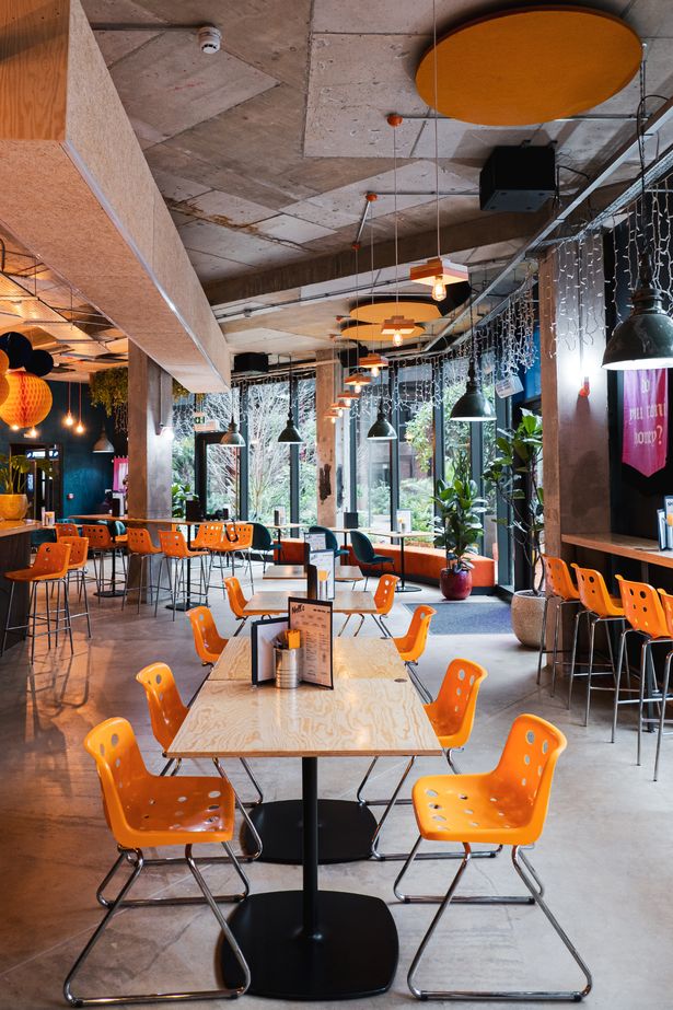 Vibrant event space at Nell's Kampus with flexible seating for networking and meetings.