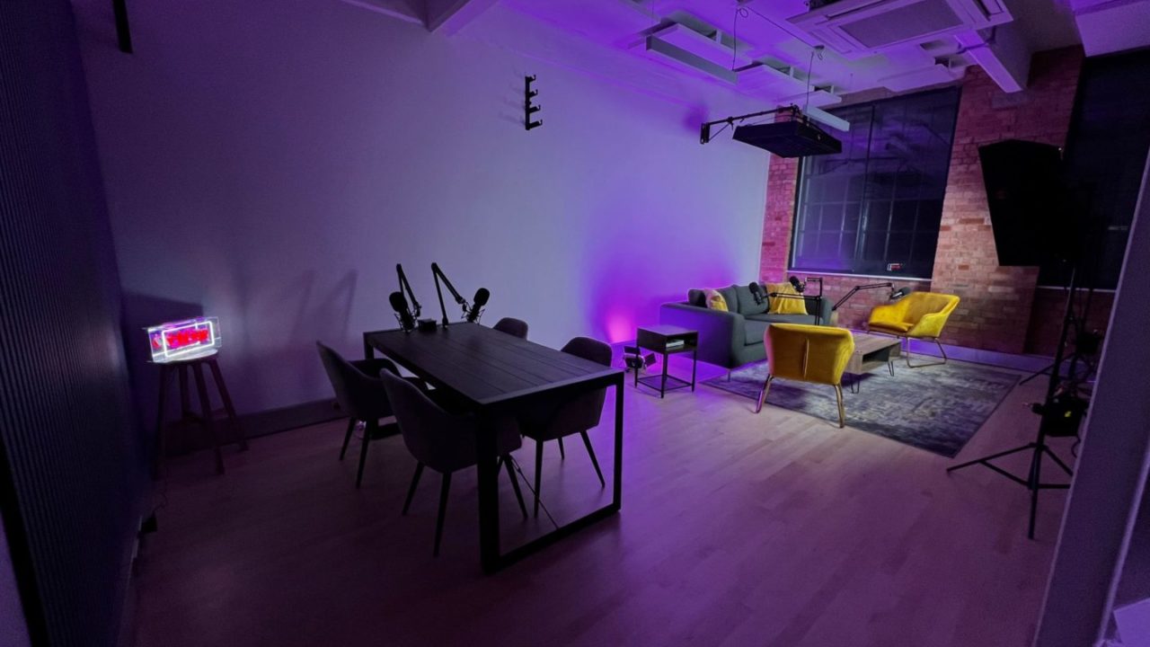 Stylish recording studio meeting space with microphones, perfect for creative gatherings.