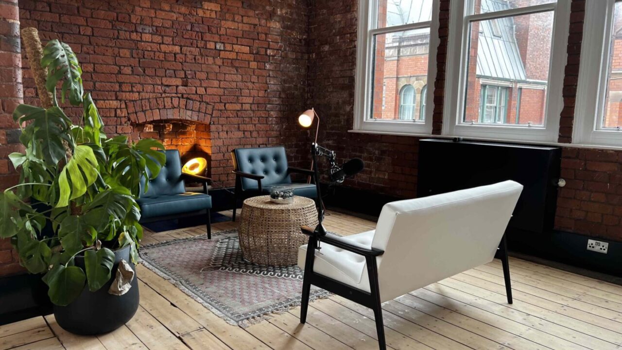 Cozy recording studio meeting space with stylish seating, perfect for brainstorming events.