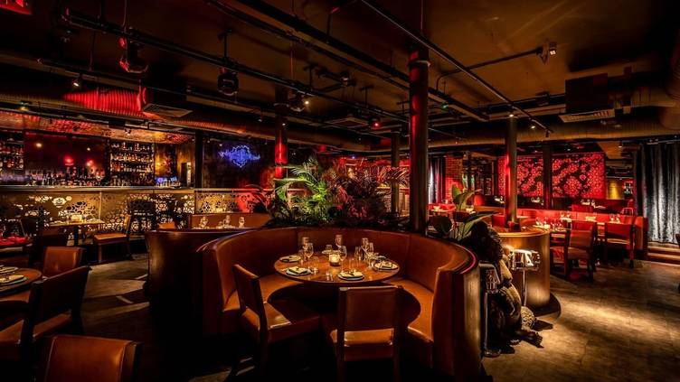 Stylish MNKY Restaurant venue with warm lighting, perfect for private events and upscale dining.