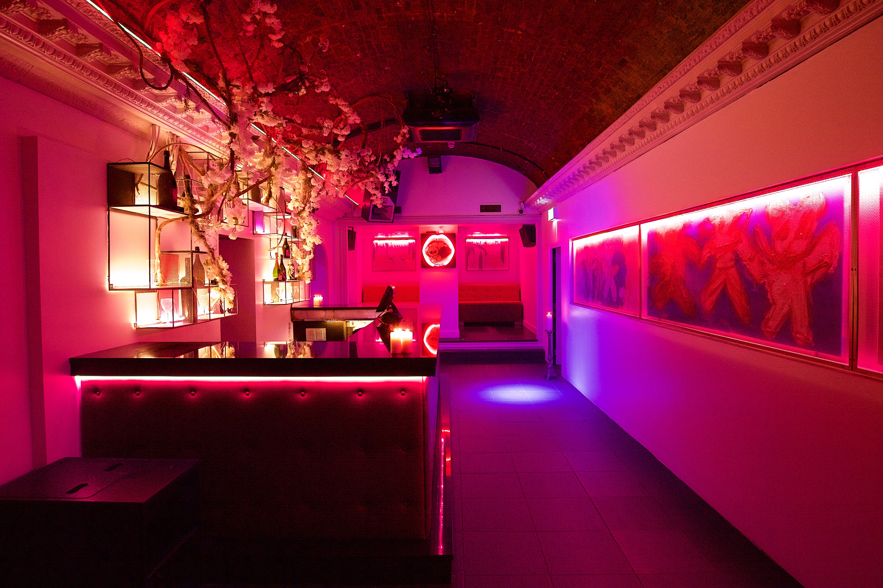 Stylish event space in Toy Room with pink lighting for cocktail receptions and gatherings.