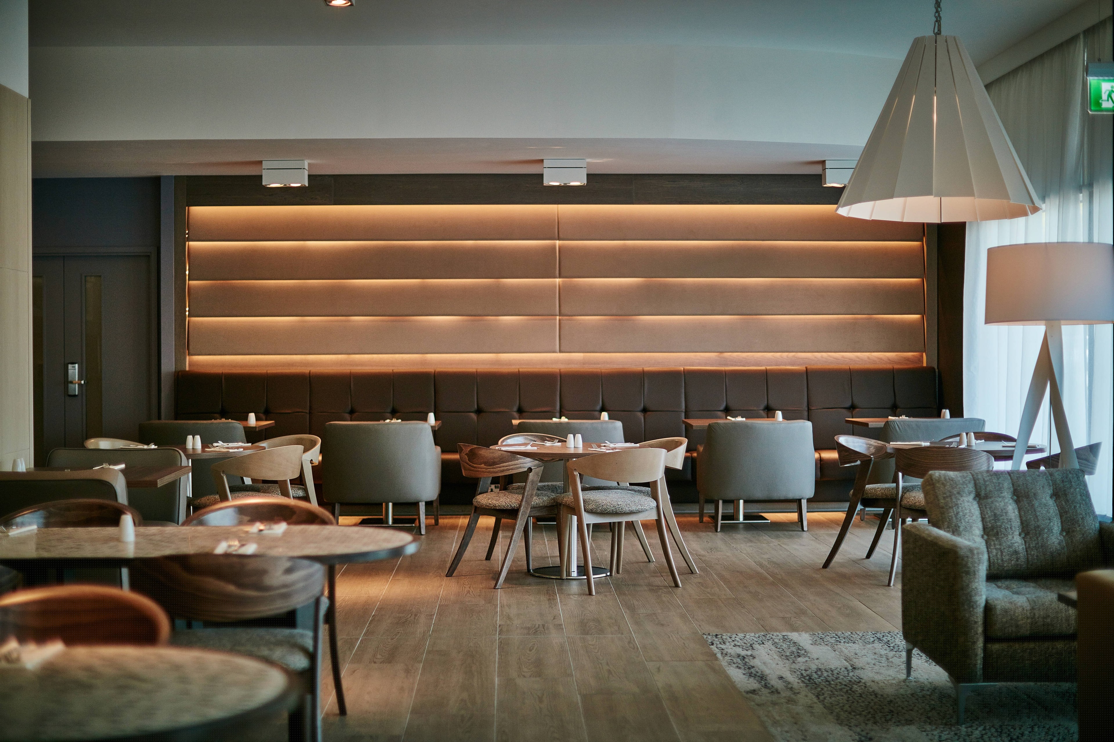 Modern event space with sleek furniture for meetings and networking at AC Hotel Manchester.