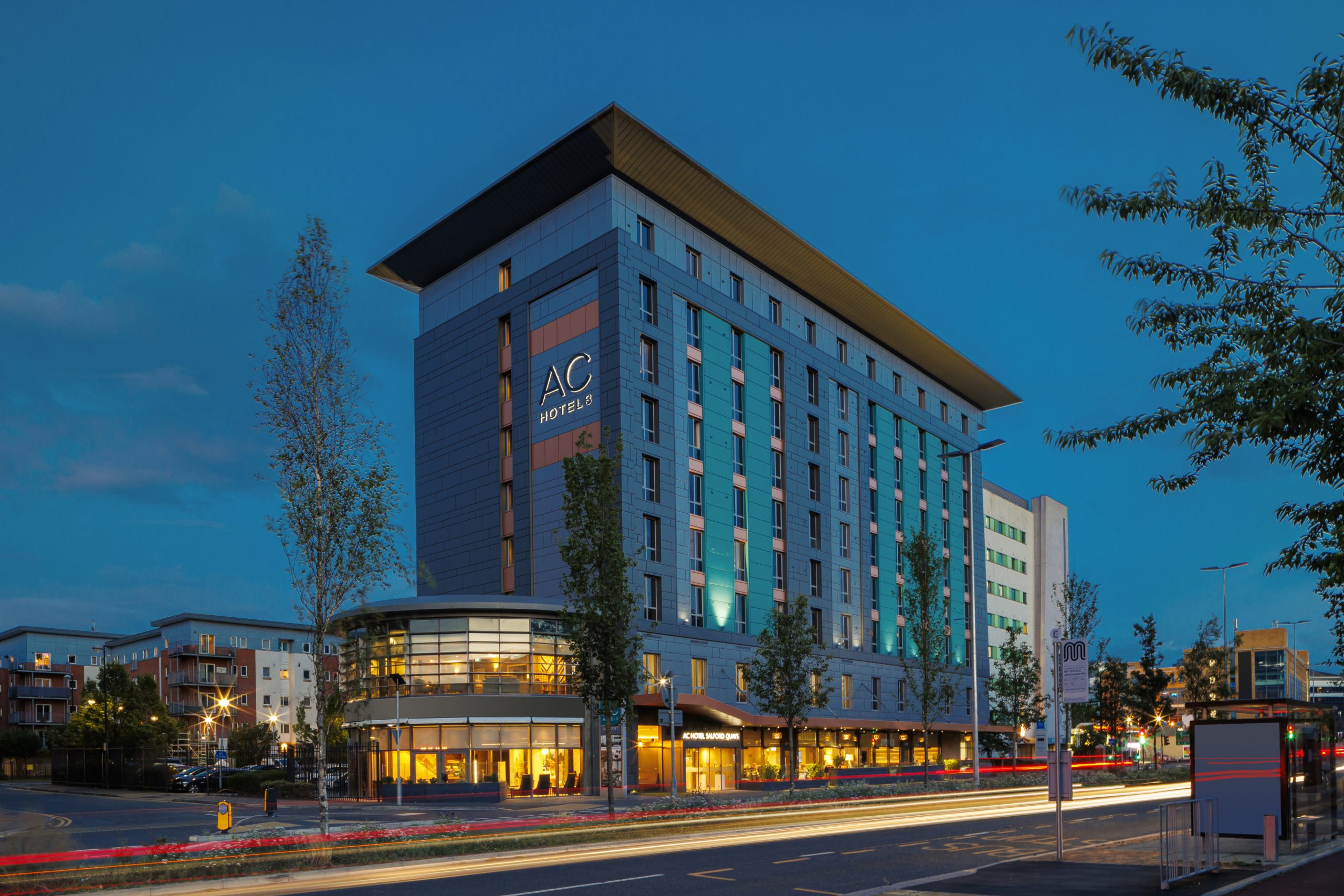 Modern AC Hotel Manchester Salford Quays exterior, ideal for corporate events and meetings.