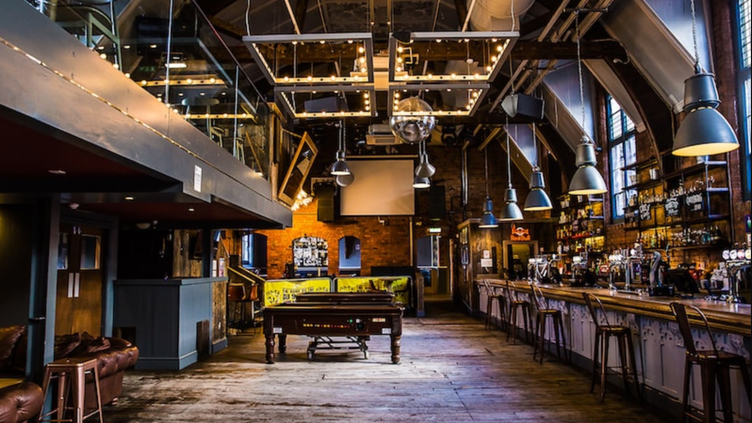 Rustic event space with exposed brick, ideal for corporate functions and private parties.