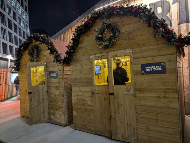 Charming wooden karaoke hut for outdoor events and holiday markets.