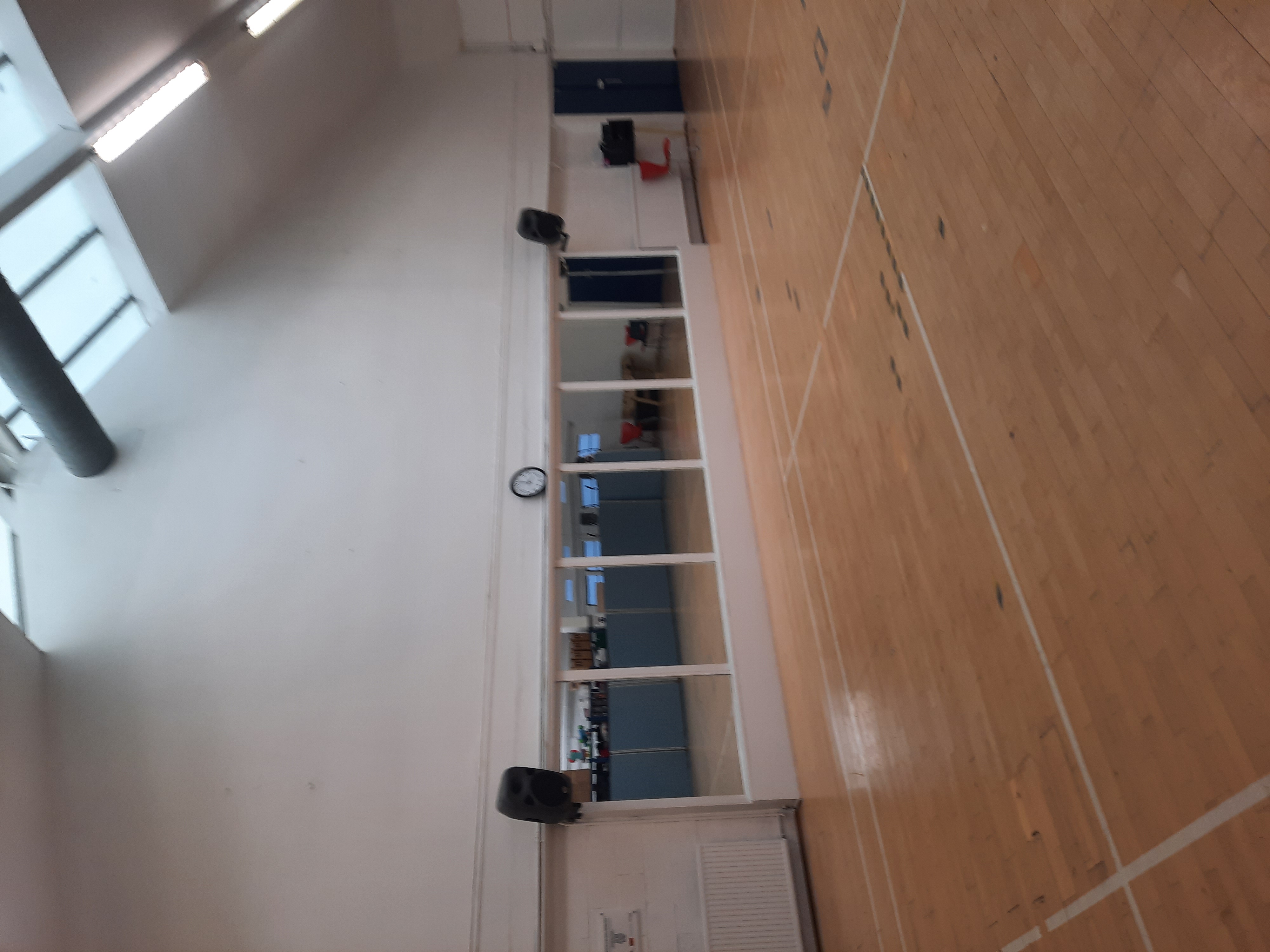 Versatile event space with mirrors in Colombo Sports & Community Centre for workshops and fitness.