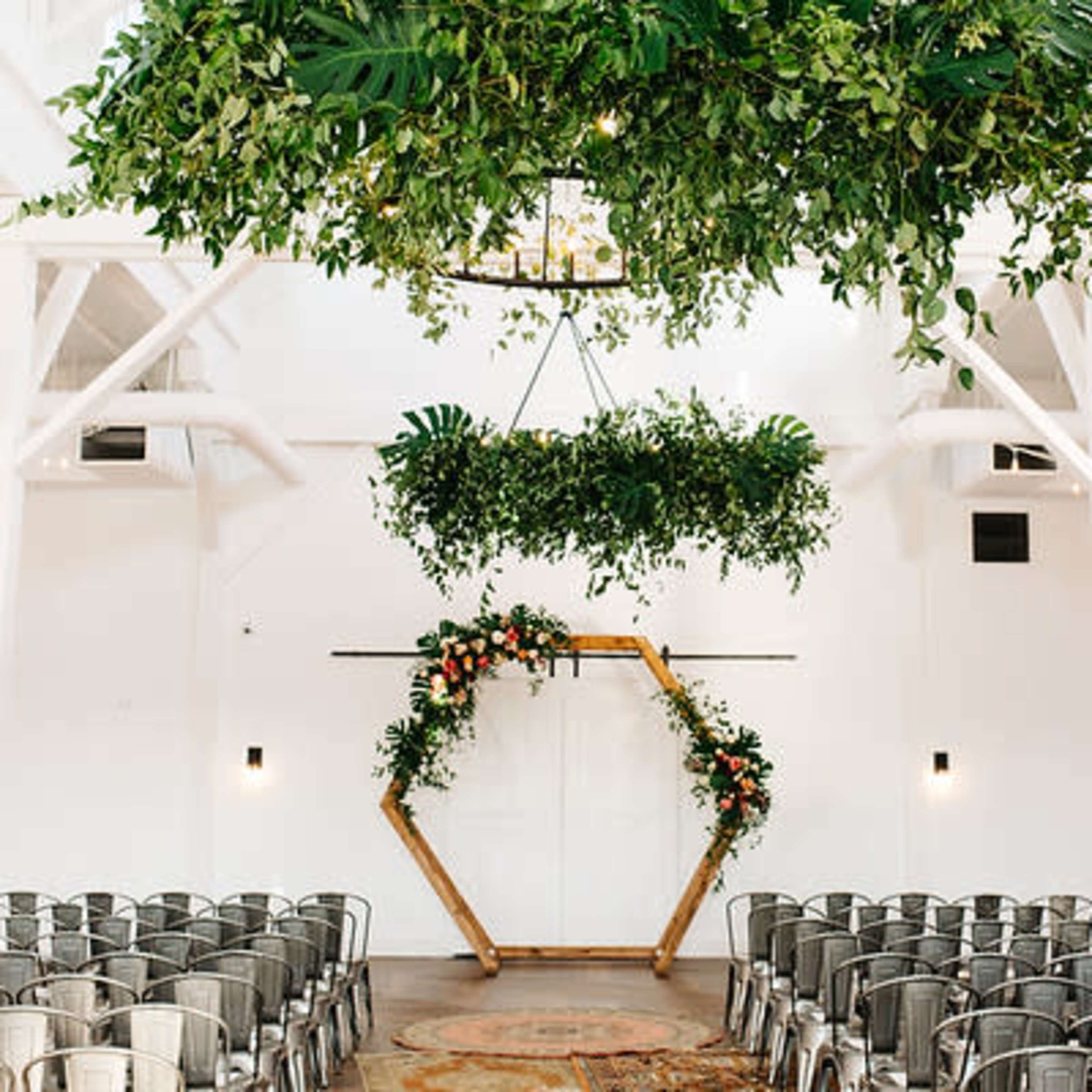 Event Hall at Spring Hill Center with modern floral arch for weddings and upscale gatherings.