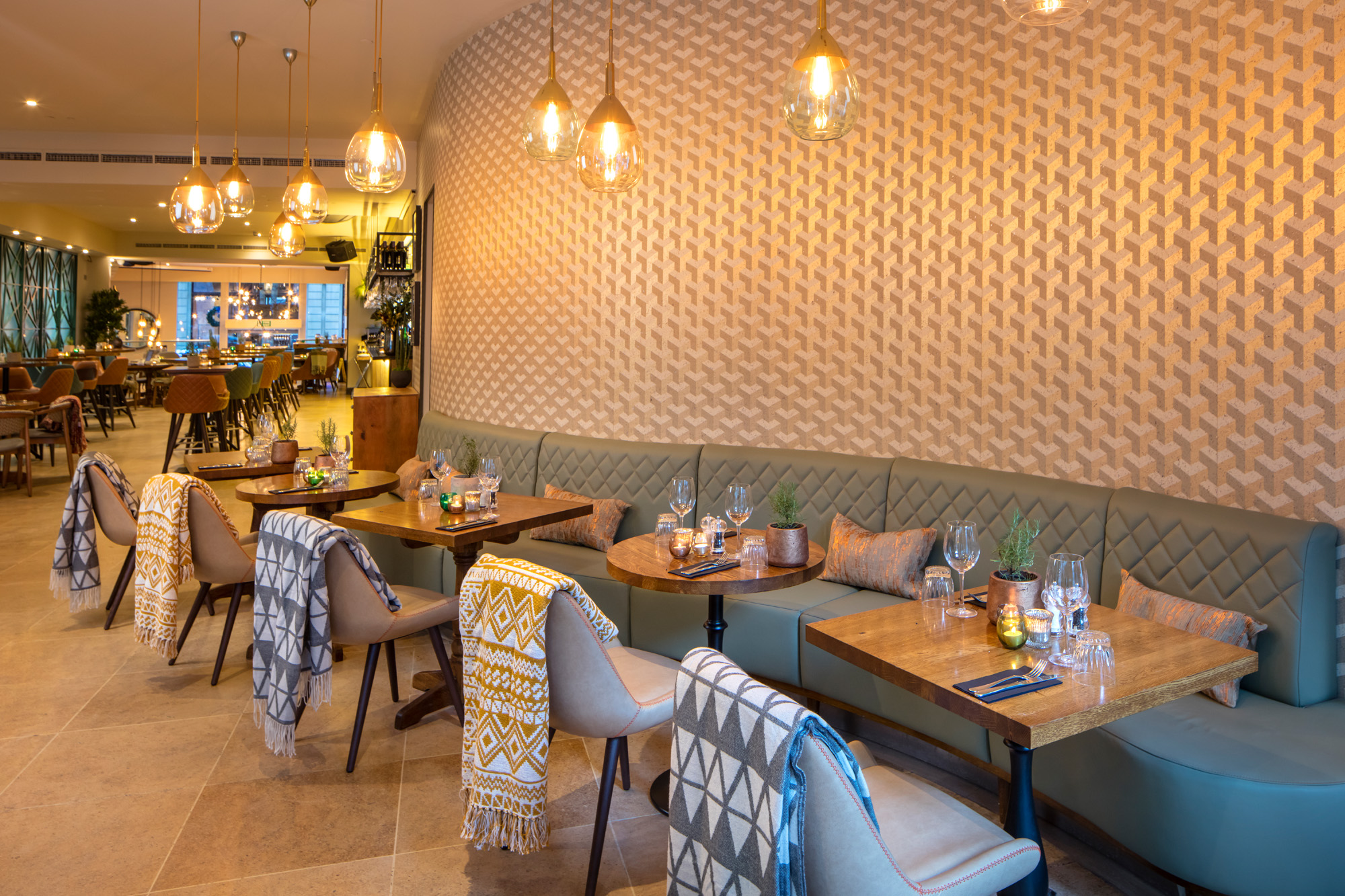 Stylish restaurant interior with cozy seating, ideal for intimate gatherings and corporate events.