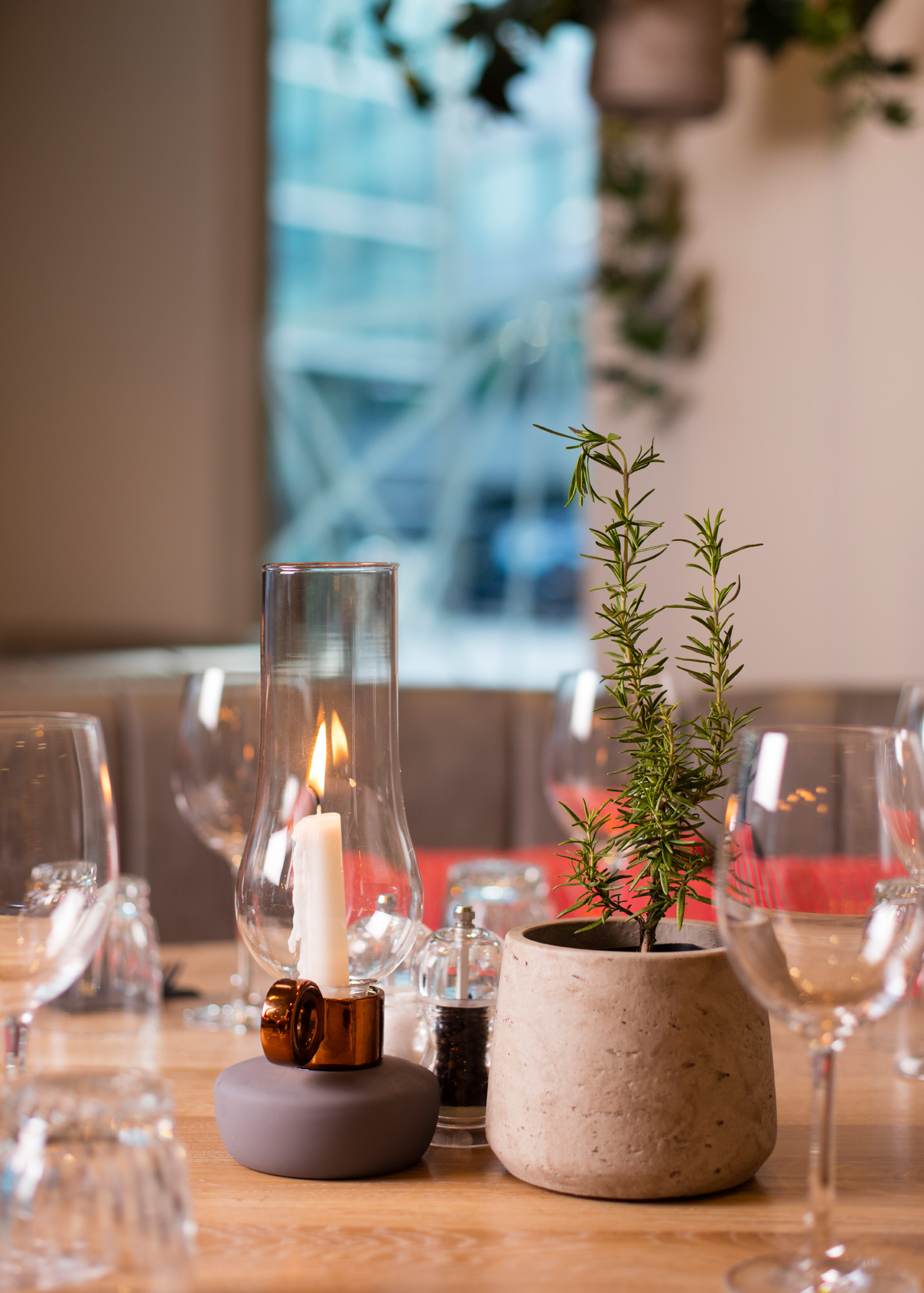 Elegant dining table with rosemary centerpiece for intimate upscale event at The Otherist.