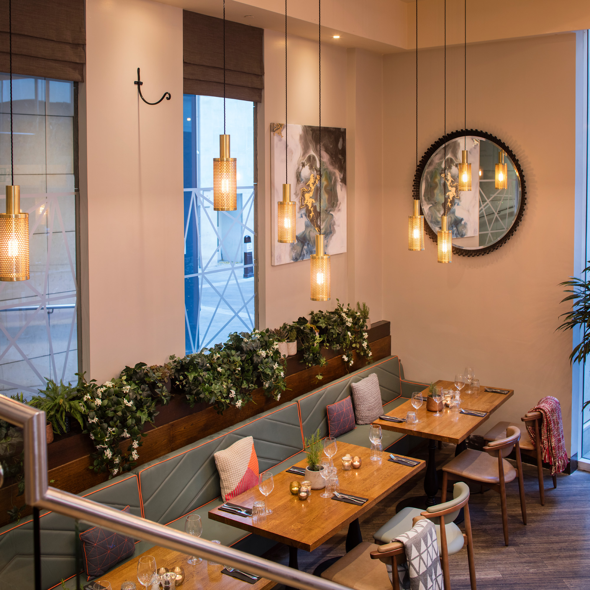 Stylish restaurant interior with warm lighting, ideal for intimate meetings and events.