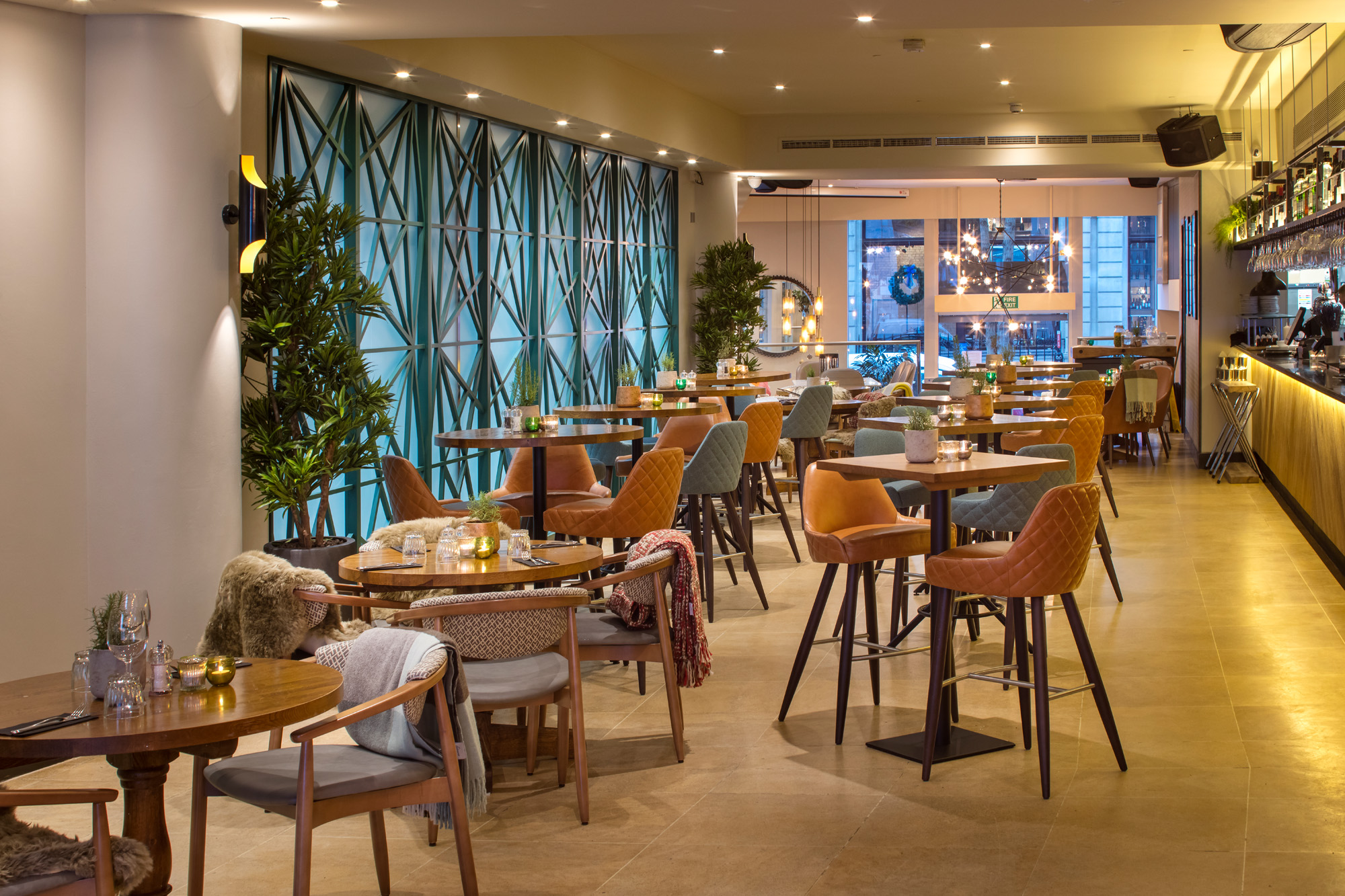 Modern event space with warm lighting, ideal for gatherings and networking.