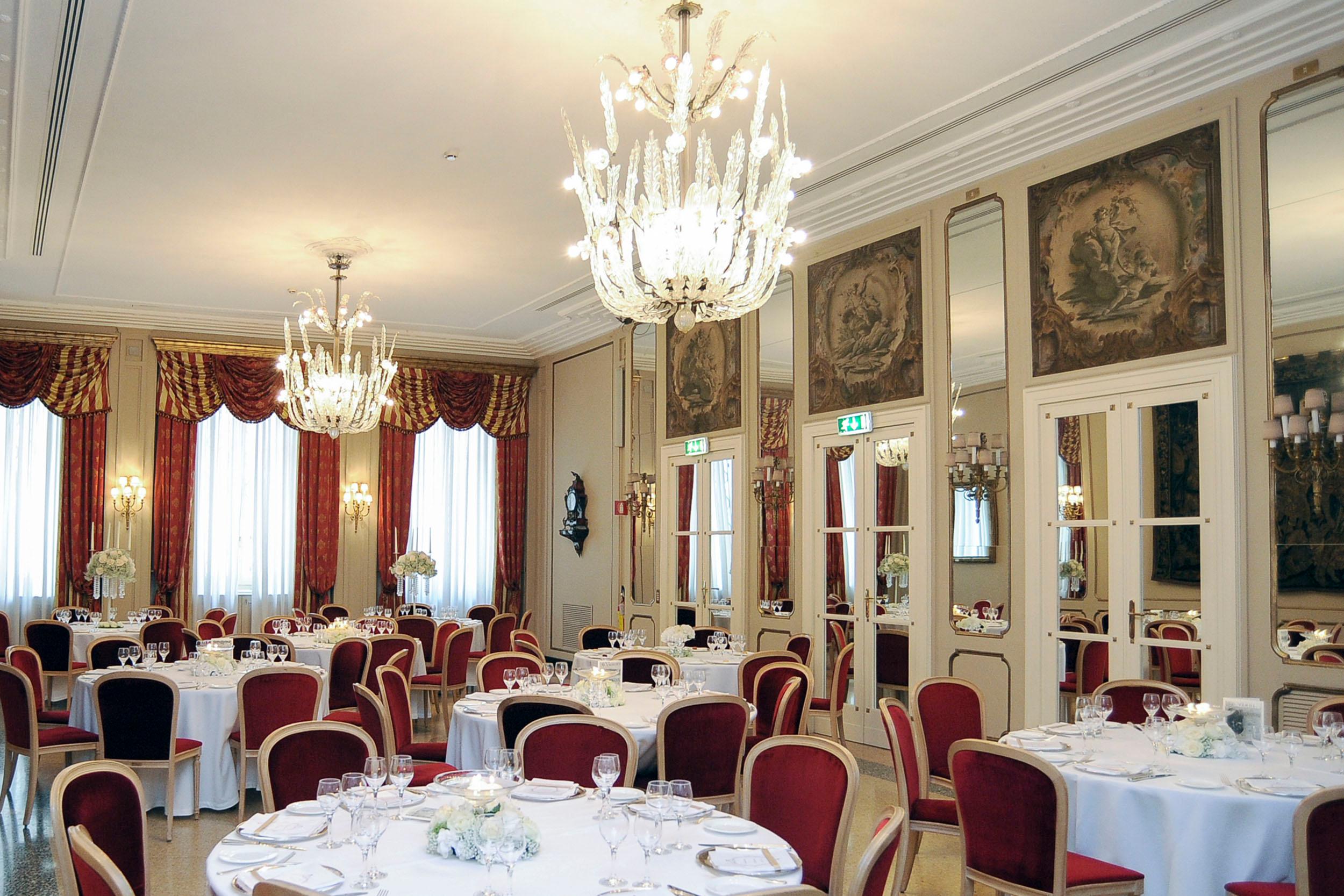 Elegant Puccini Salon banquet hall with chandeliers, ideal for upscale events and celebrations.