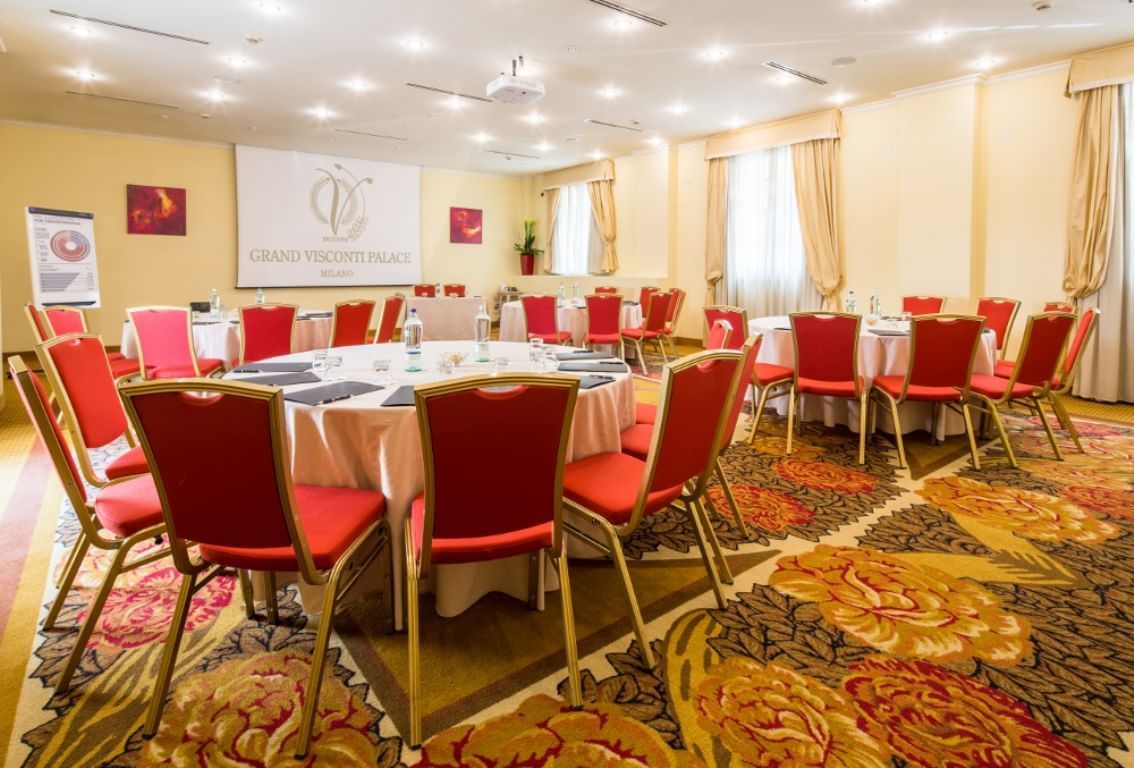 Function room in Palazzo Visconti, set for workshops and conferences with elegant decor.
