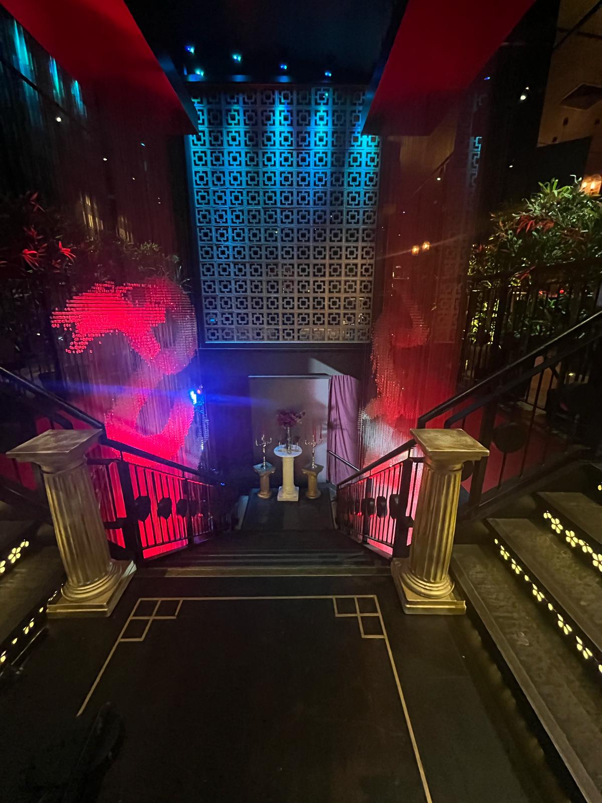 Gala event entrance, opulent columns, cascading fabric, VIP launch.