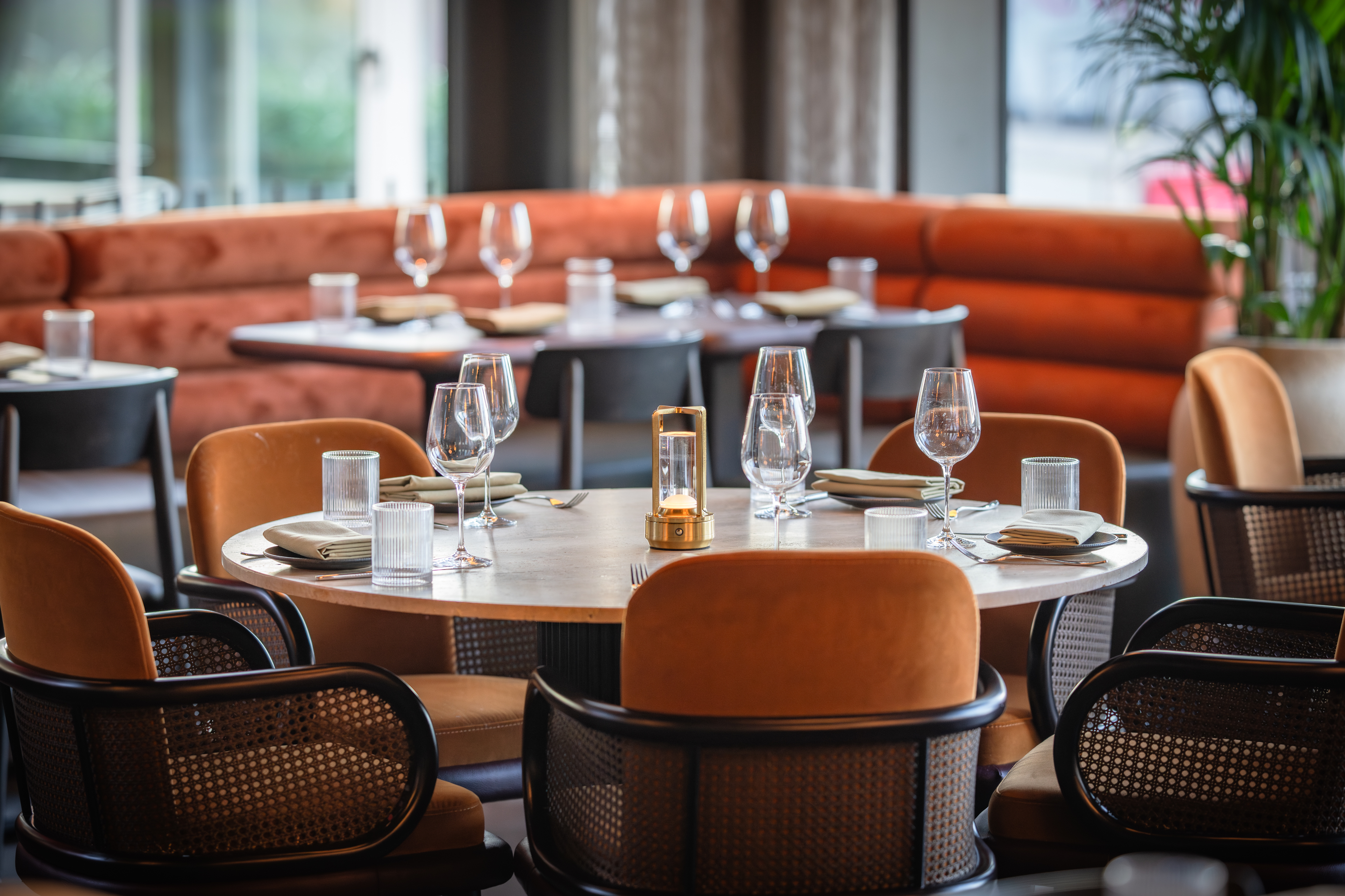 Iris Hall dining setup at HERA Restaurant, elegant decor for corporate events and gatherings.