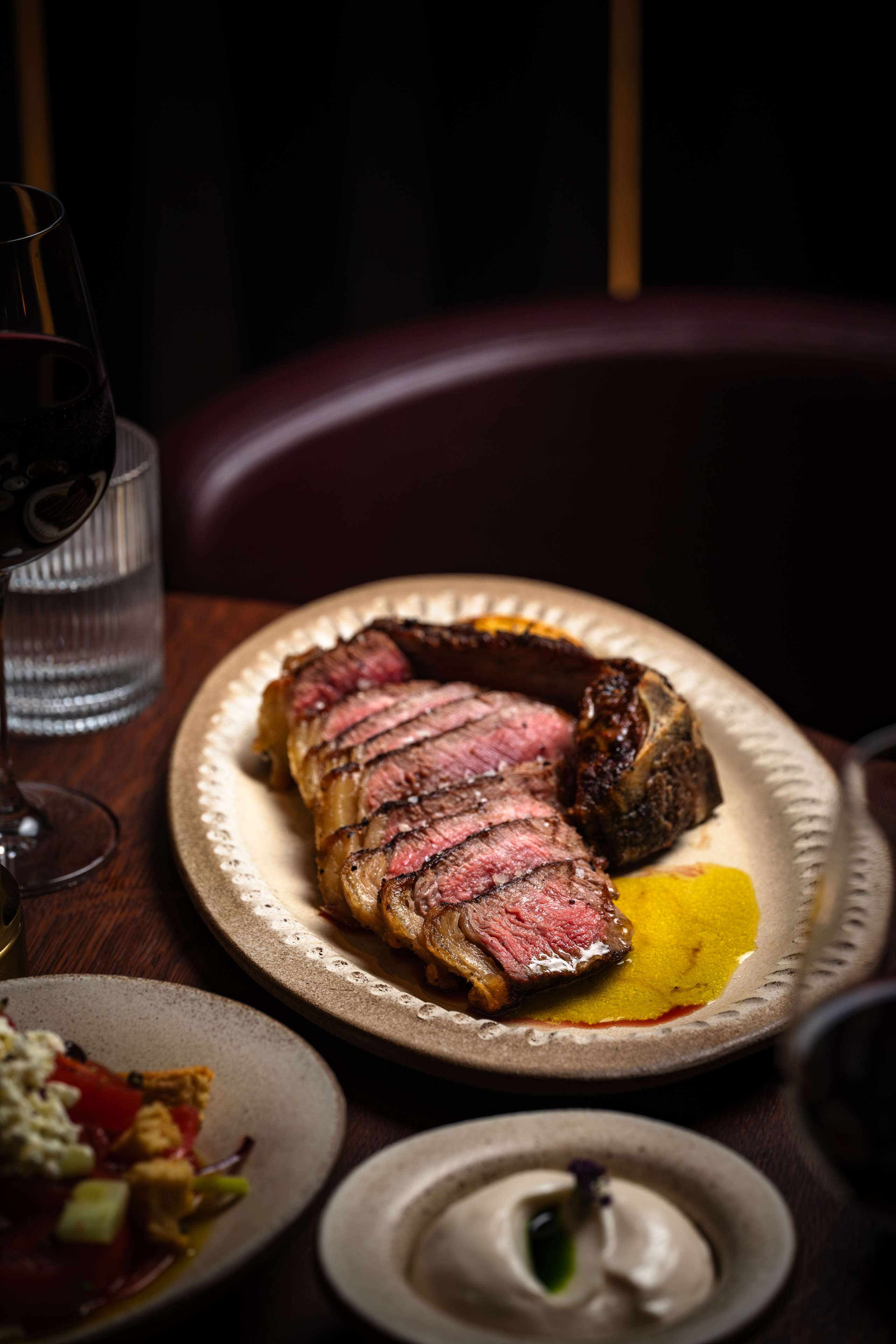 Plated steak at HERA Restaurant, ideal for corporate dinners and upscale events.