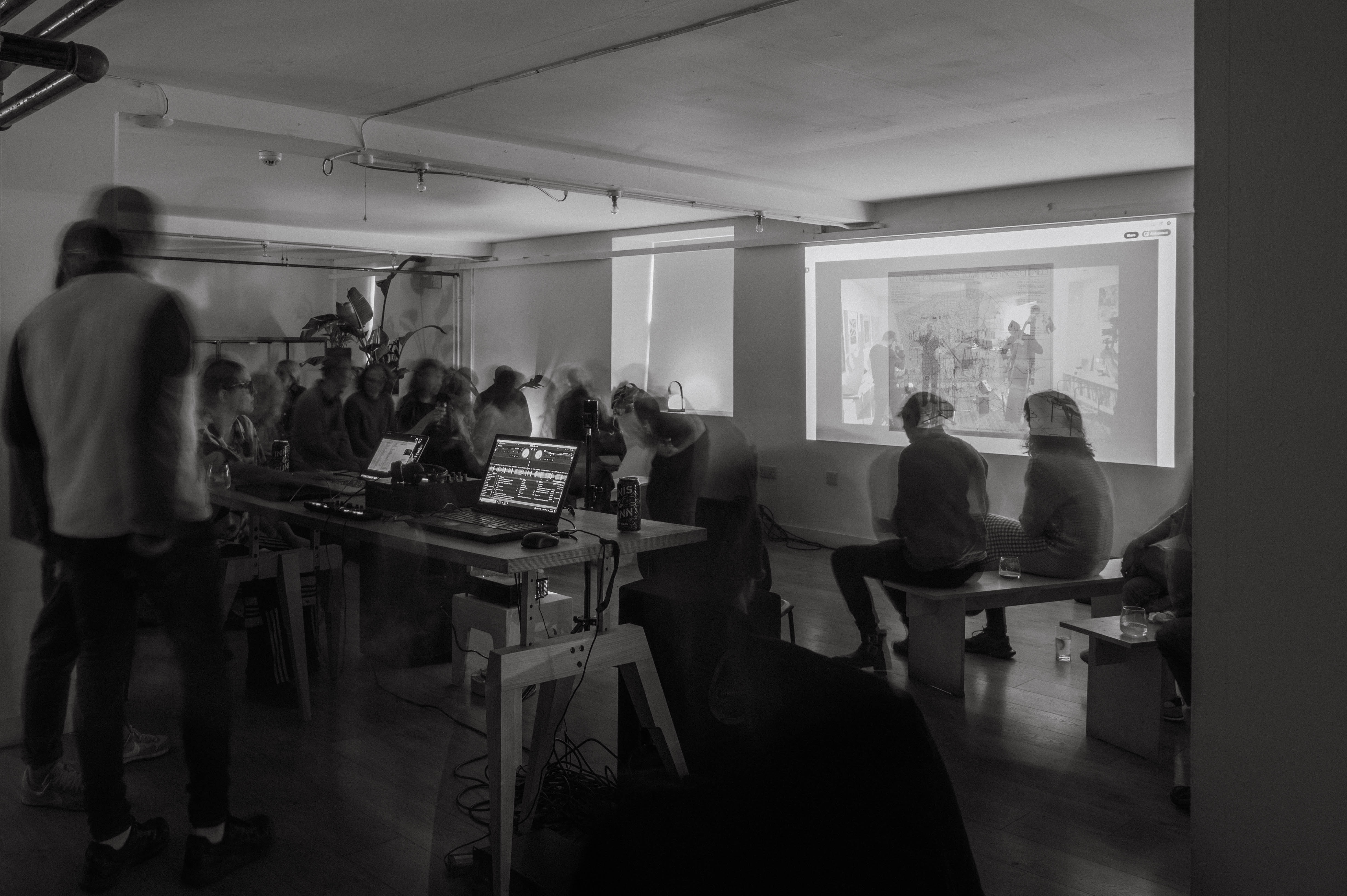 Collaborative event space with projector, fostering teamwork and creativity.