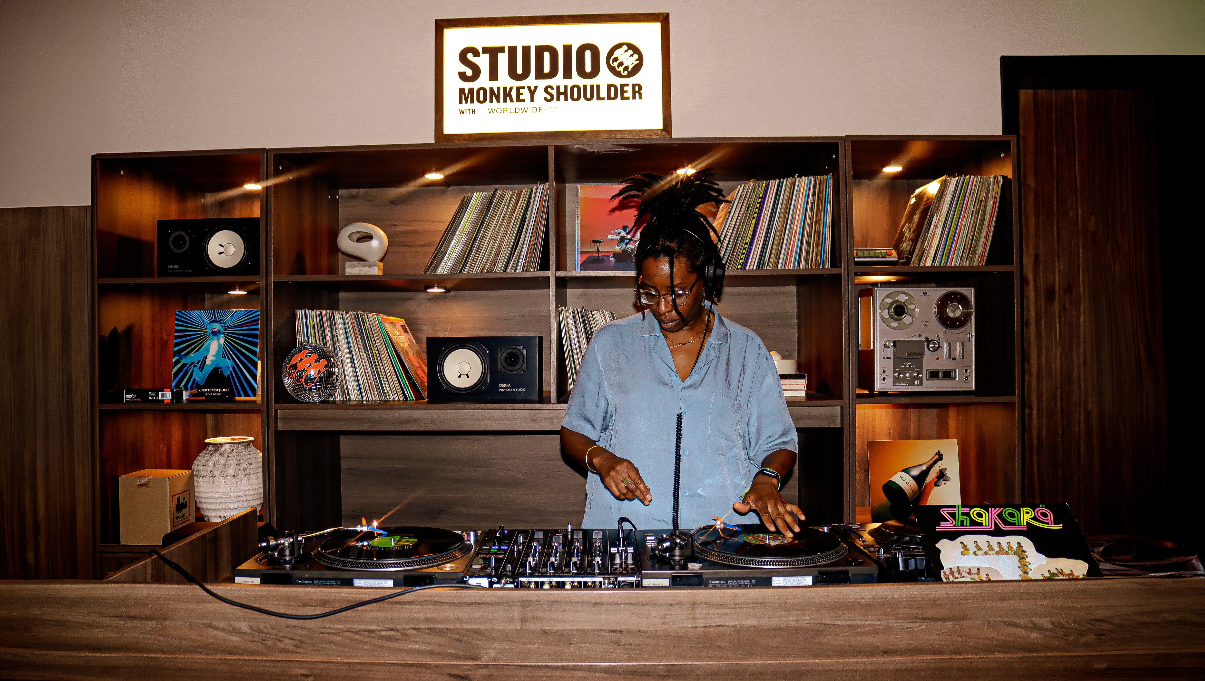 Vibrant Qube Elephant Lounge event space with DJ, ideal for networking and social gatherings.