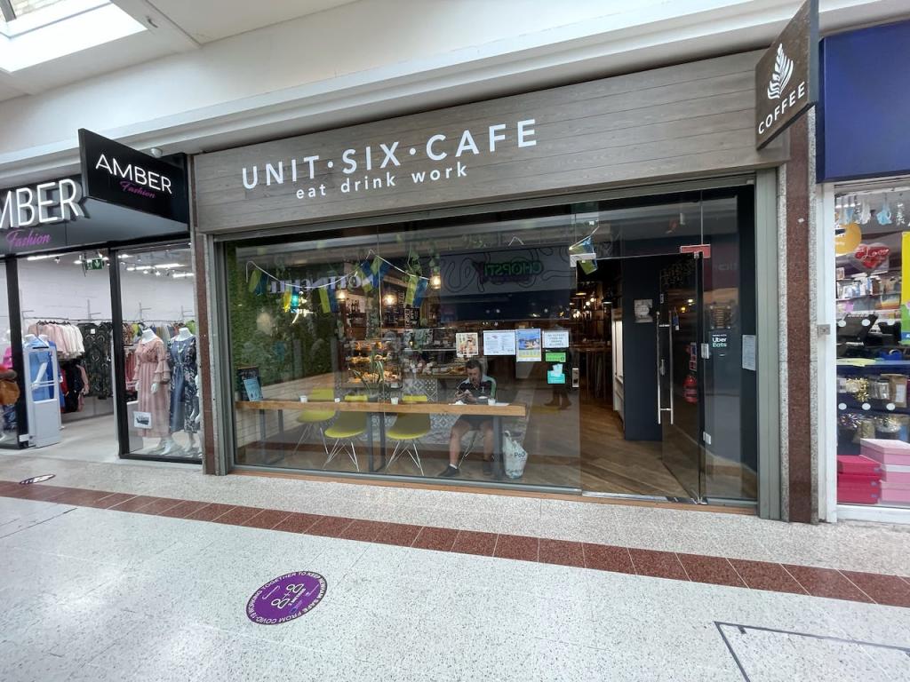 Modern cafe, natural light, business meeting, networking event