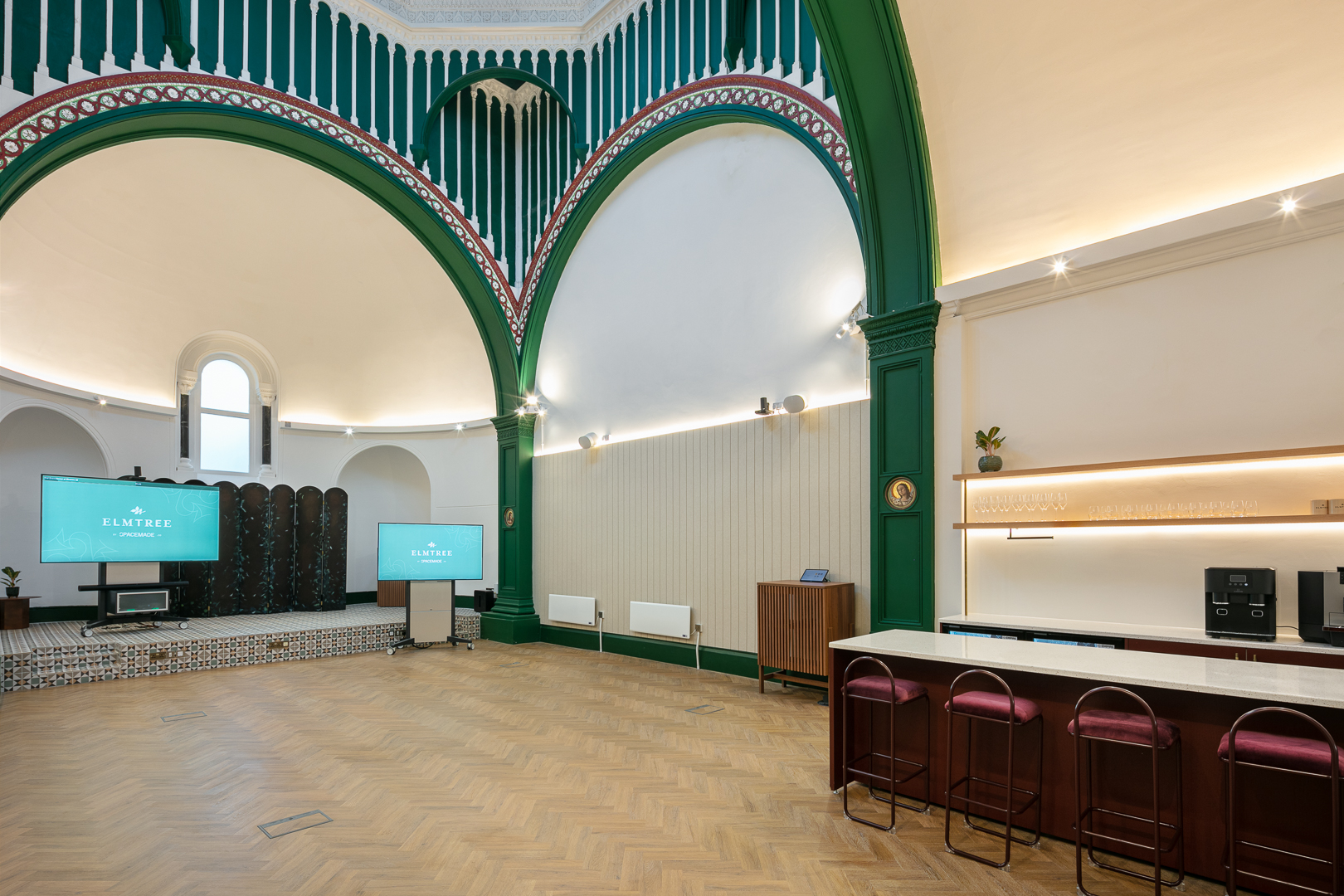 Stylish meeting space with arched ceilings, perfect for corporate events and workshops.