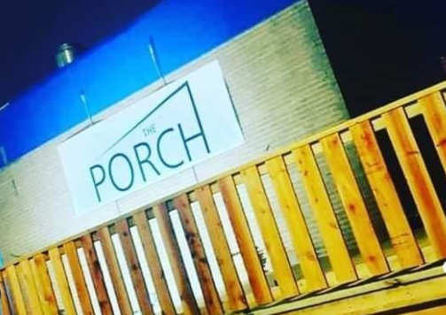The Porch Peckham: Rustic deck, modern sign, outdoor event venue