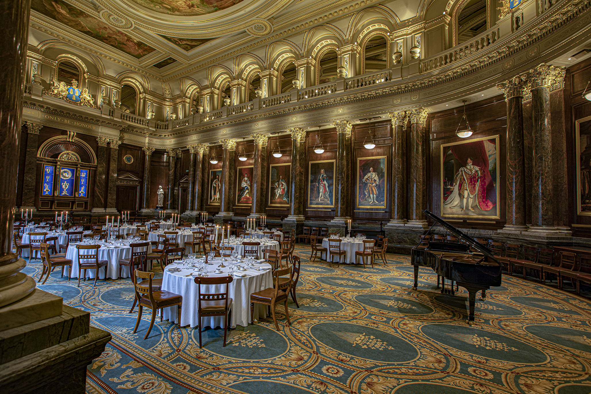 Elegant Livery Hall with round tables, ideal for formal gatherings and gala dinners.
