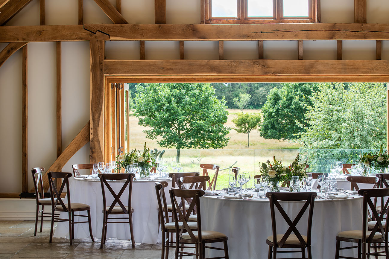 Elegant round tables in rustic Brookfield Barn, perfect for weddings and events.
