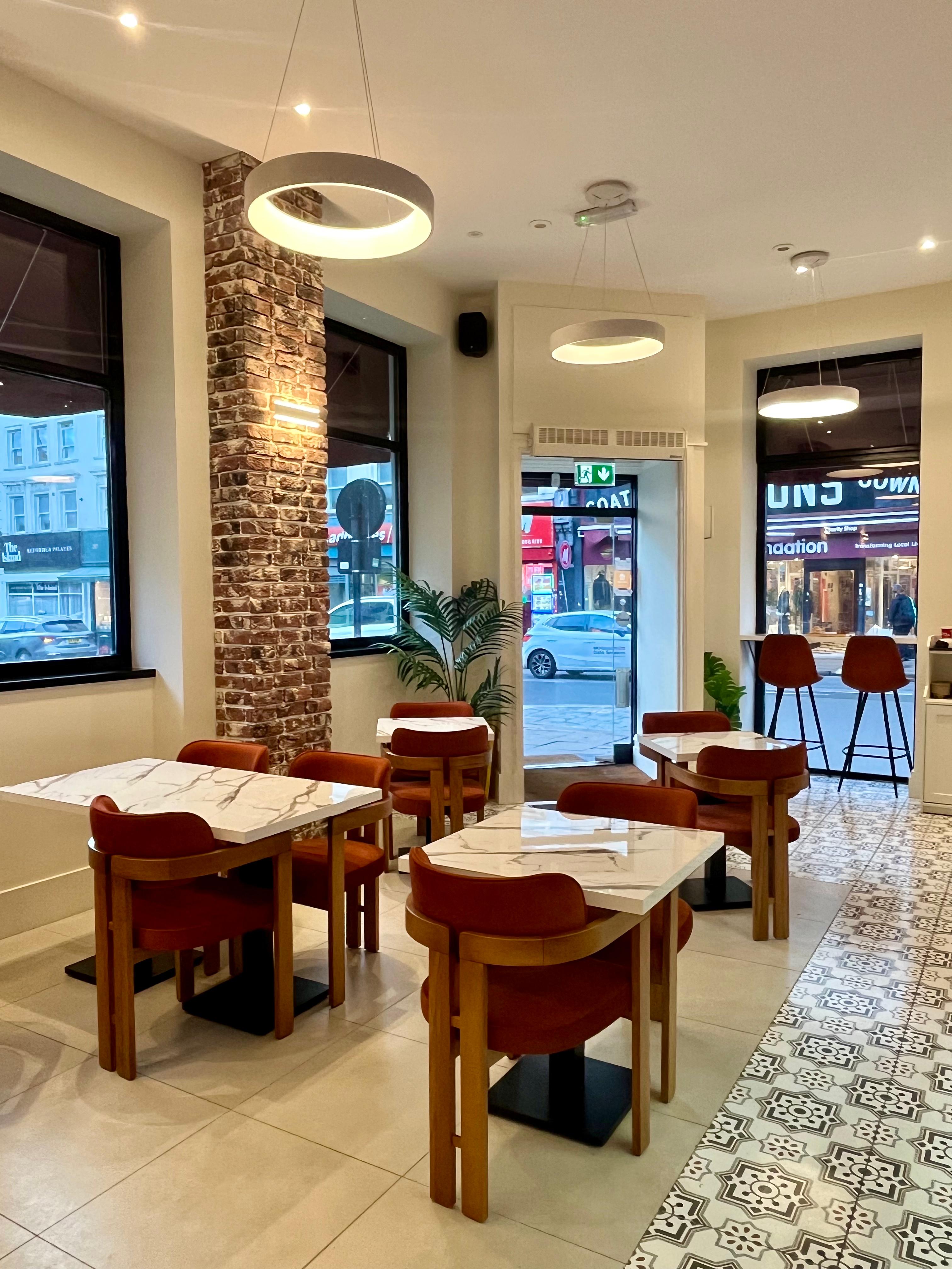 Modern cafe venue for small networking events and informal breakout sessions.