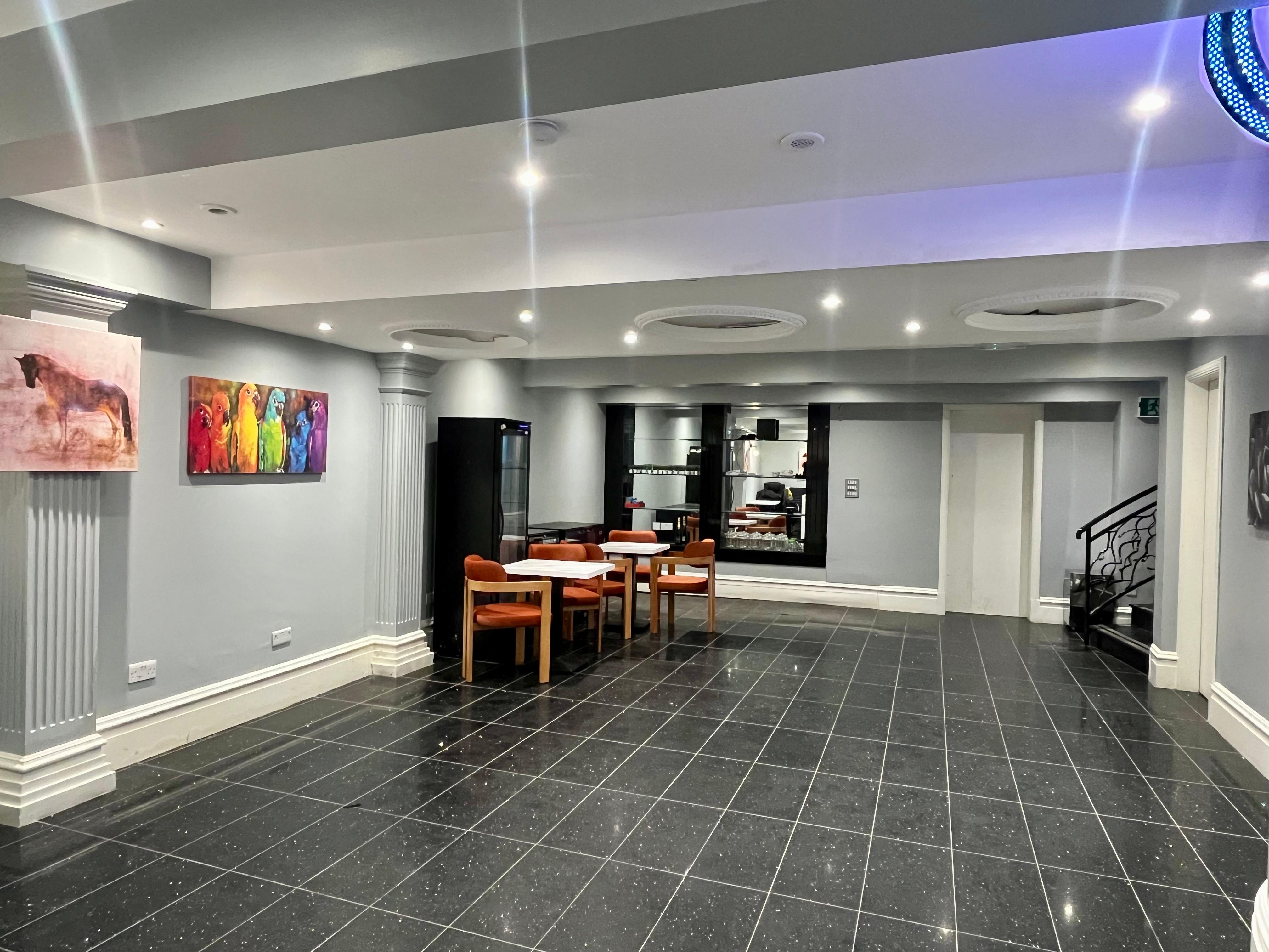 Cramped Cafe breakout space with disjointed seating for professional event venue rental.