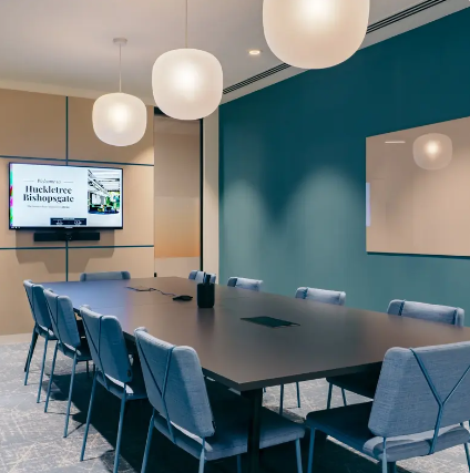 Modern boardroom with integrated AV technology for hybrid meetings and professional events.