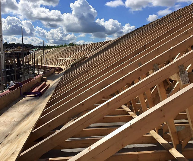 Stephens & Giles carpenter inspecting unfinished venue for event site visit.
