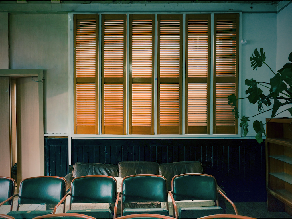 Playhouse East waiting area, intimate event, workshop space, green decor.