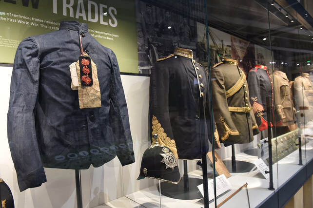 Historical uniforms in RLC Museum meeting room for corporate event and networking venue.