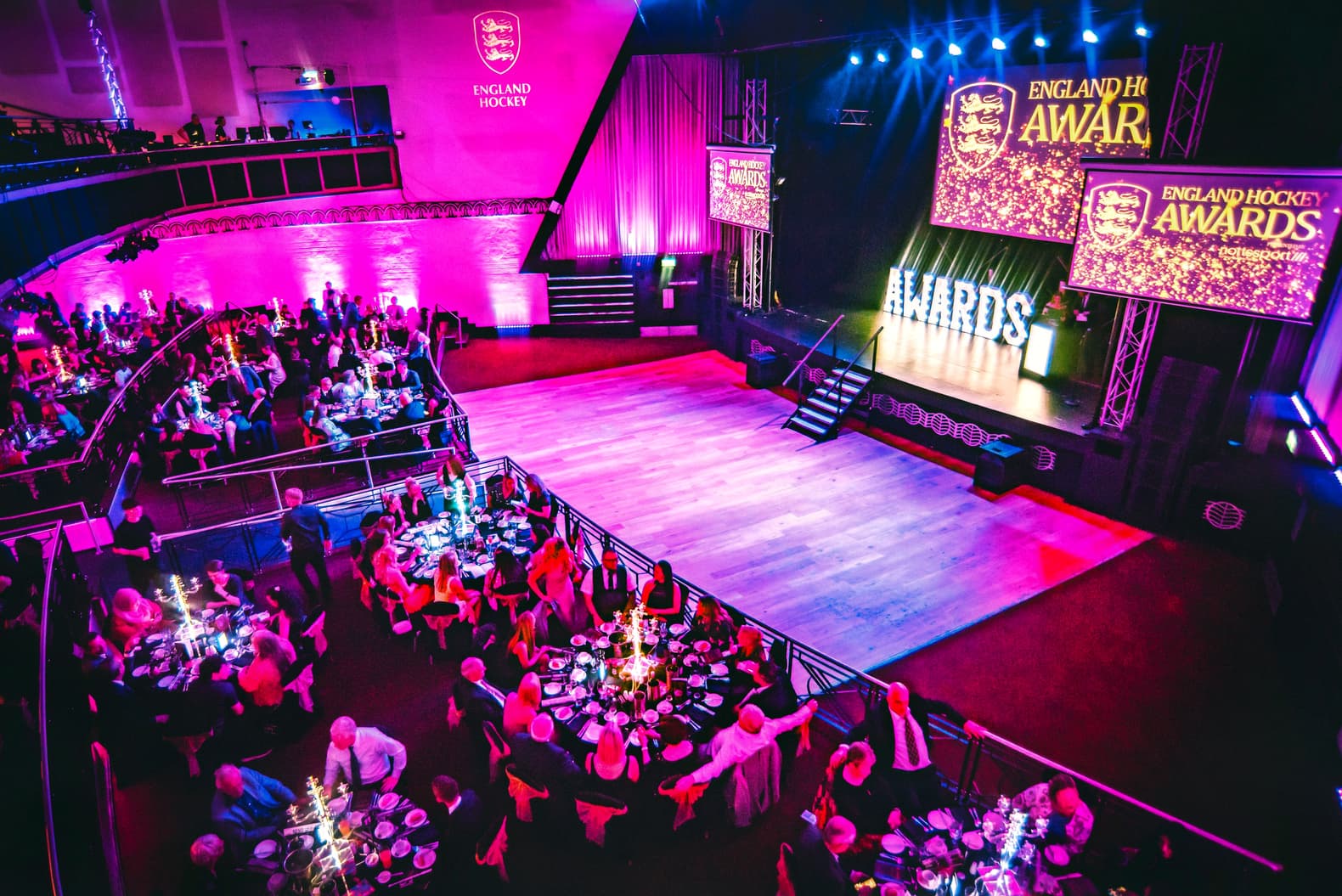 Elegant awards ceremony at Cinema Suite, Athena with vibrant decor and lively atmosphere.