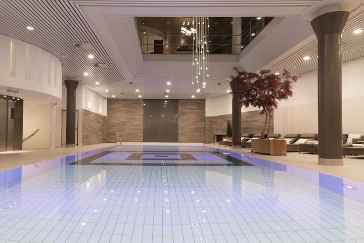 Modern pool area at Hotel Okura Amsterdam, perfect for wellness retreats and gatherings.