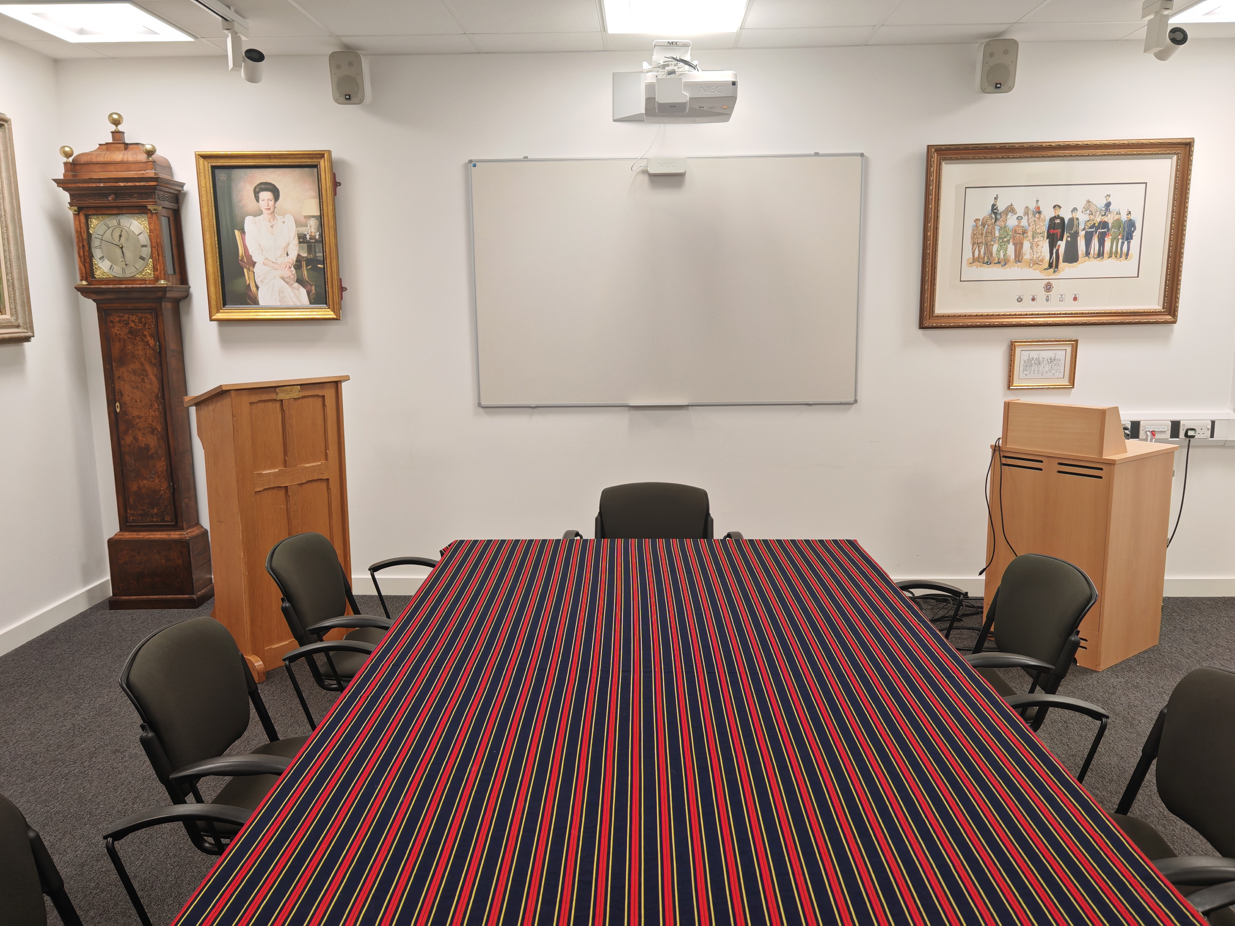 Boardroom meeting room at The RLC Museum with dated table linens for corporate event hire.