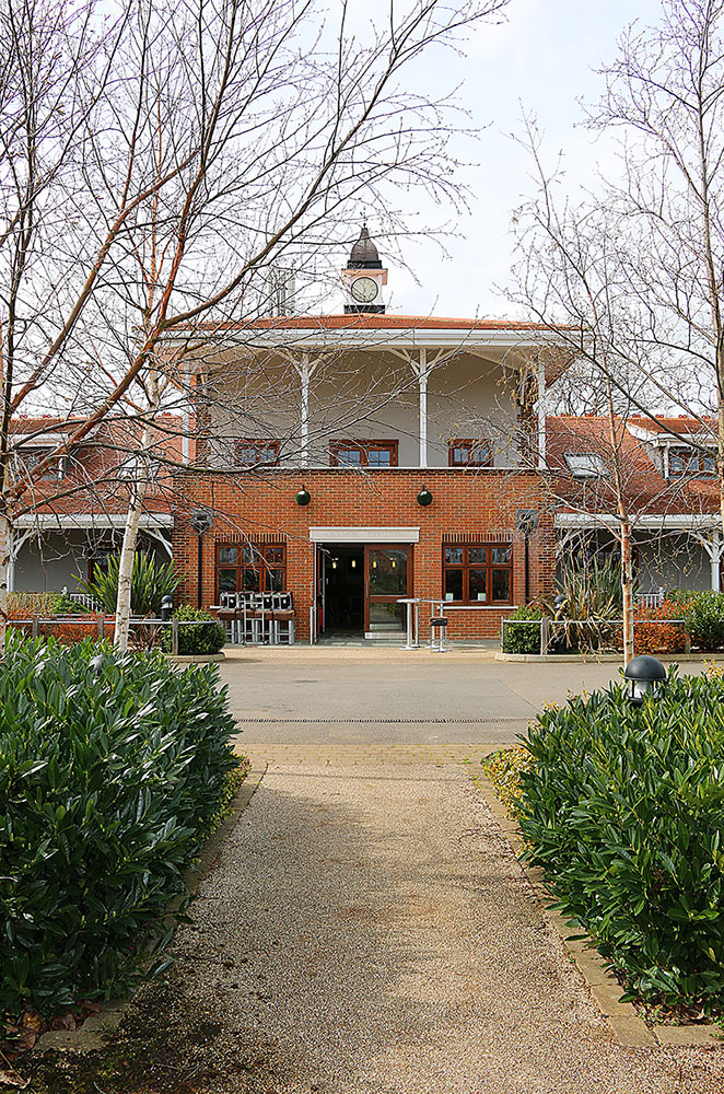 Olympic Pavilion at Trailfinders Sports Club, ideal for events with charming brickwork and greenery.