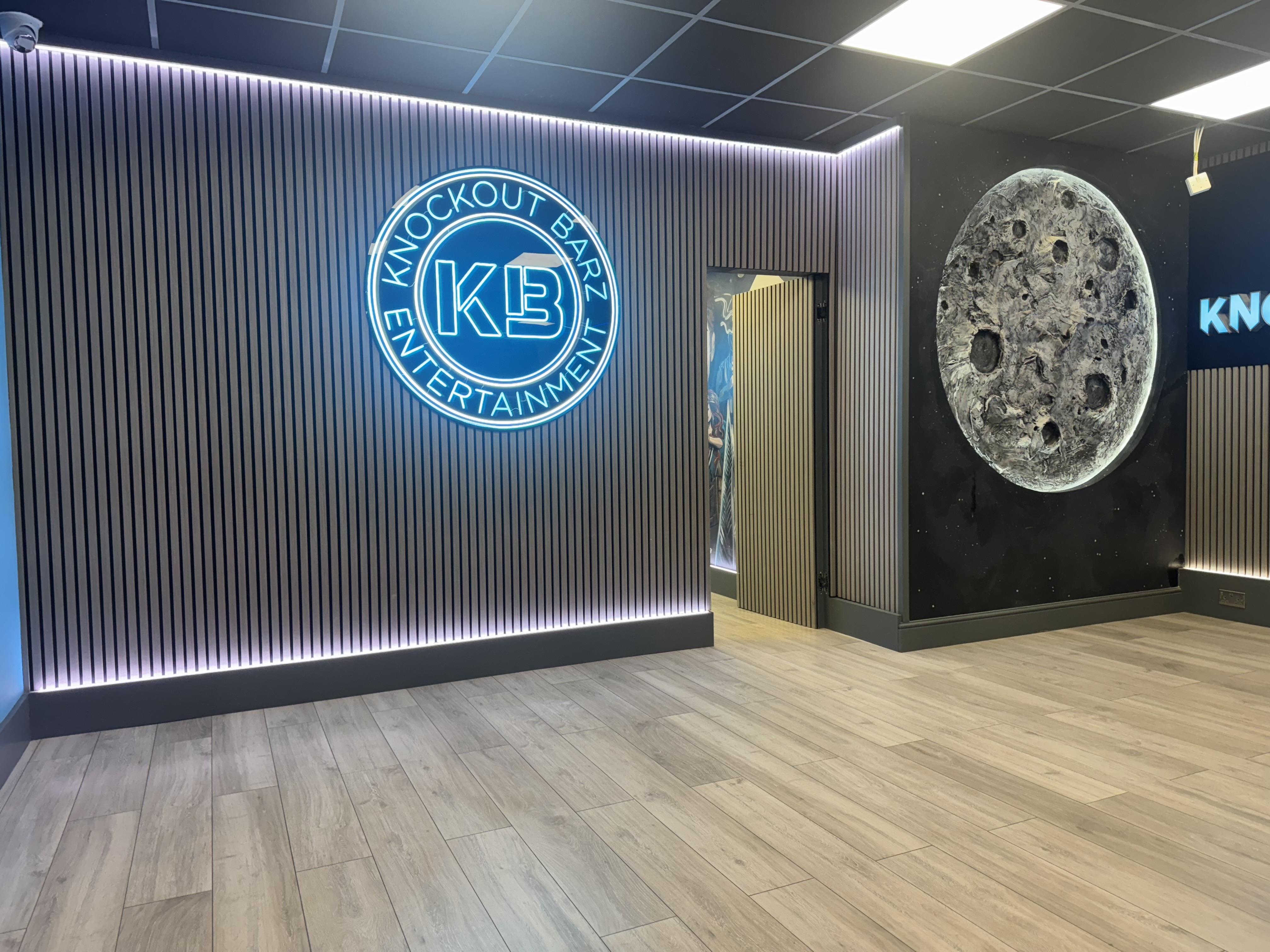 Modern LED-lit event entrance at Knockout Barz for experiential activations.