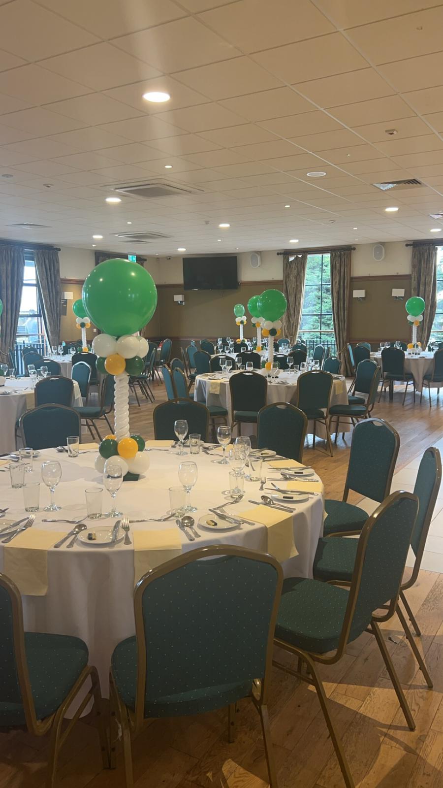 Emerald Hall banquet setup with traditional table rounds for wedding and corporate event planning.