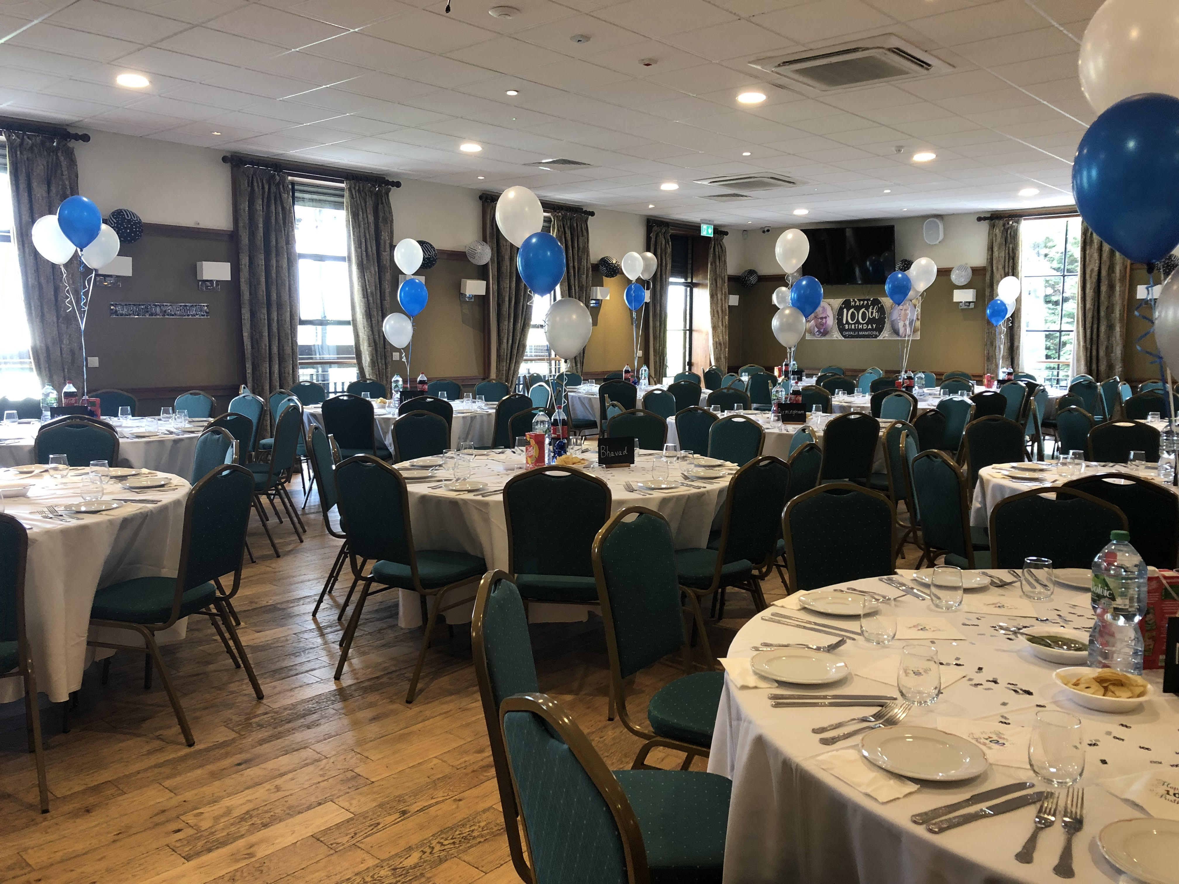 Emerald Hall banquet setup with round tables for milestone events and wedding venue parties.