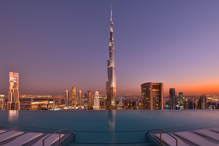 Stunning Dubai skyline at sunset with Burj Khalifa and infinity pool for events.