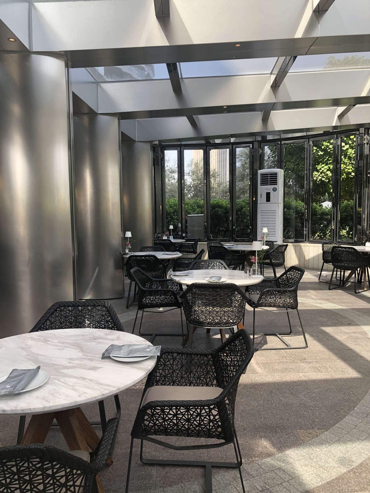 Modern lounge with marble tables, ideal for corporate events and private functions.