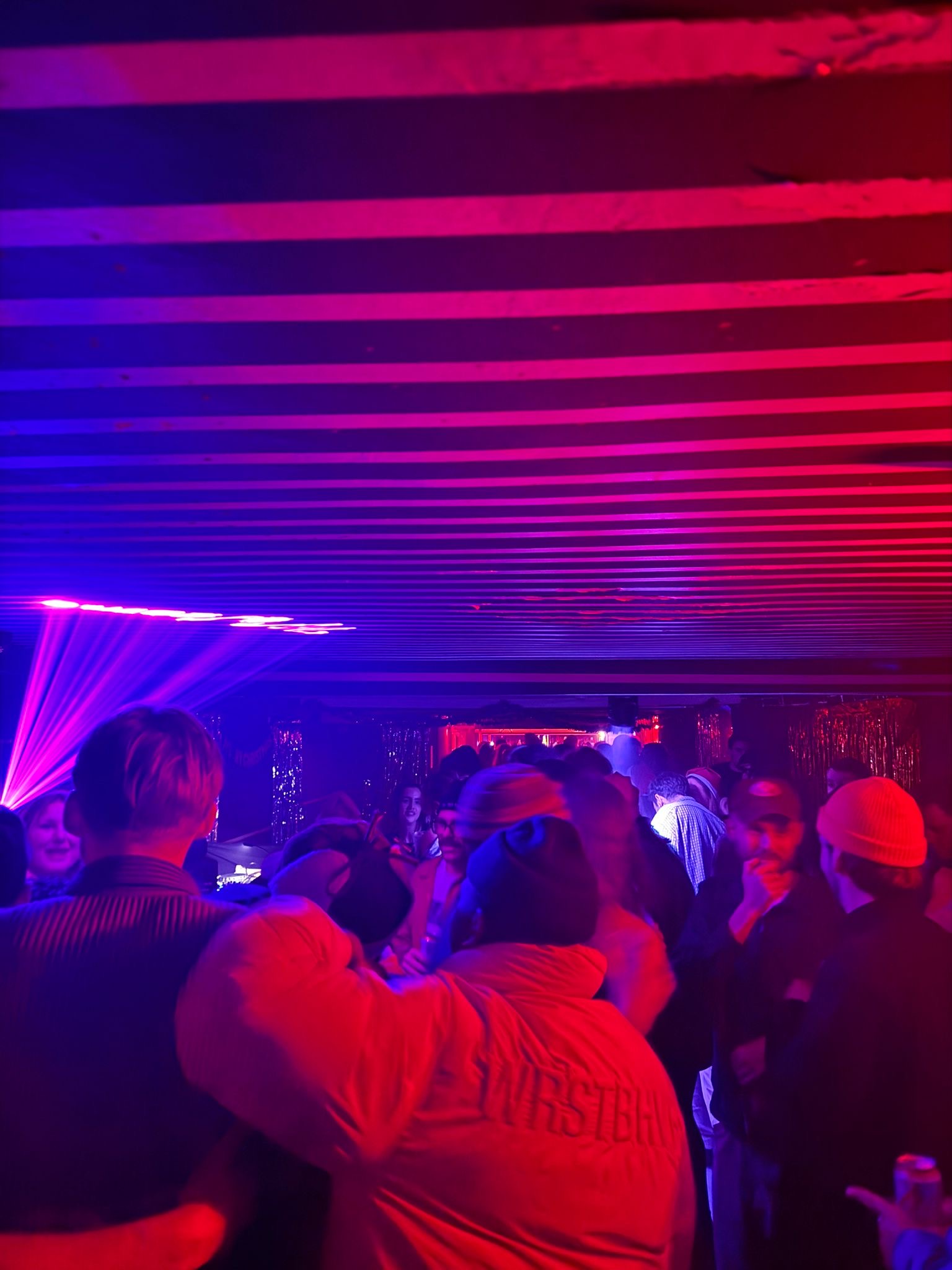 Crowded Club No8 nightclub event with laser lighting for party and concert venue hire.