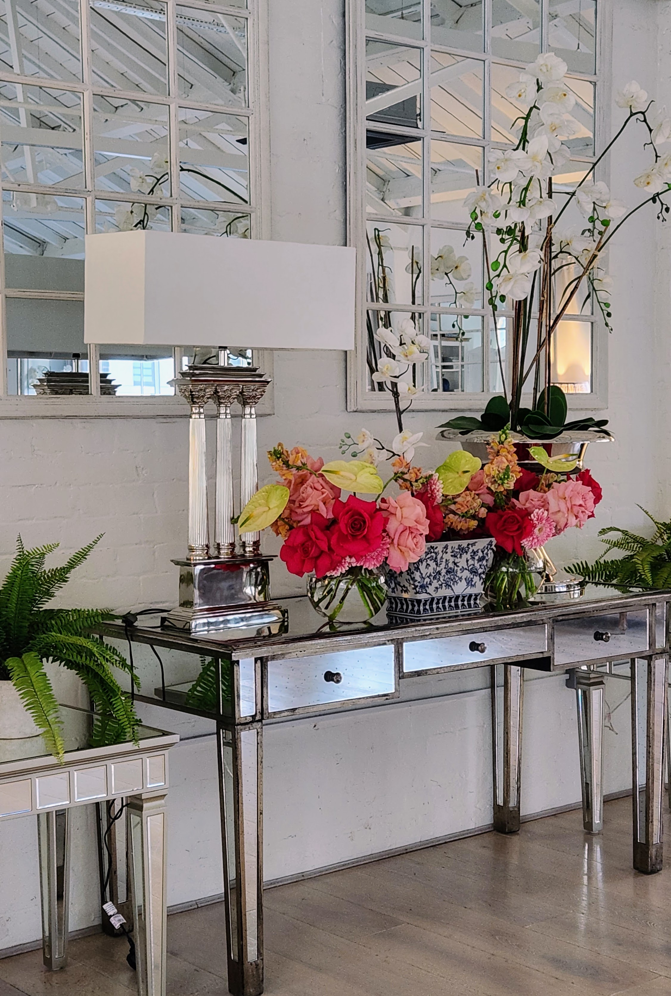Elegant entryway with floral centerpiece in Lumiere Underwood for events and meetings.