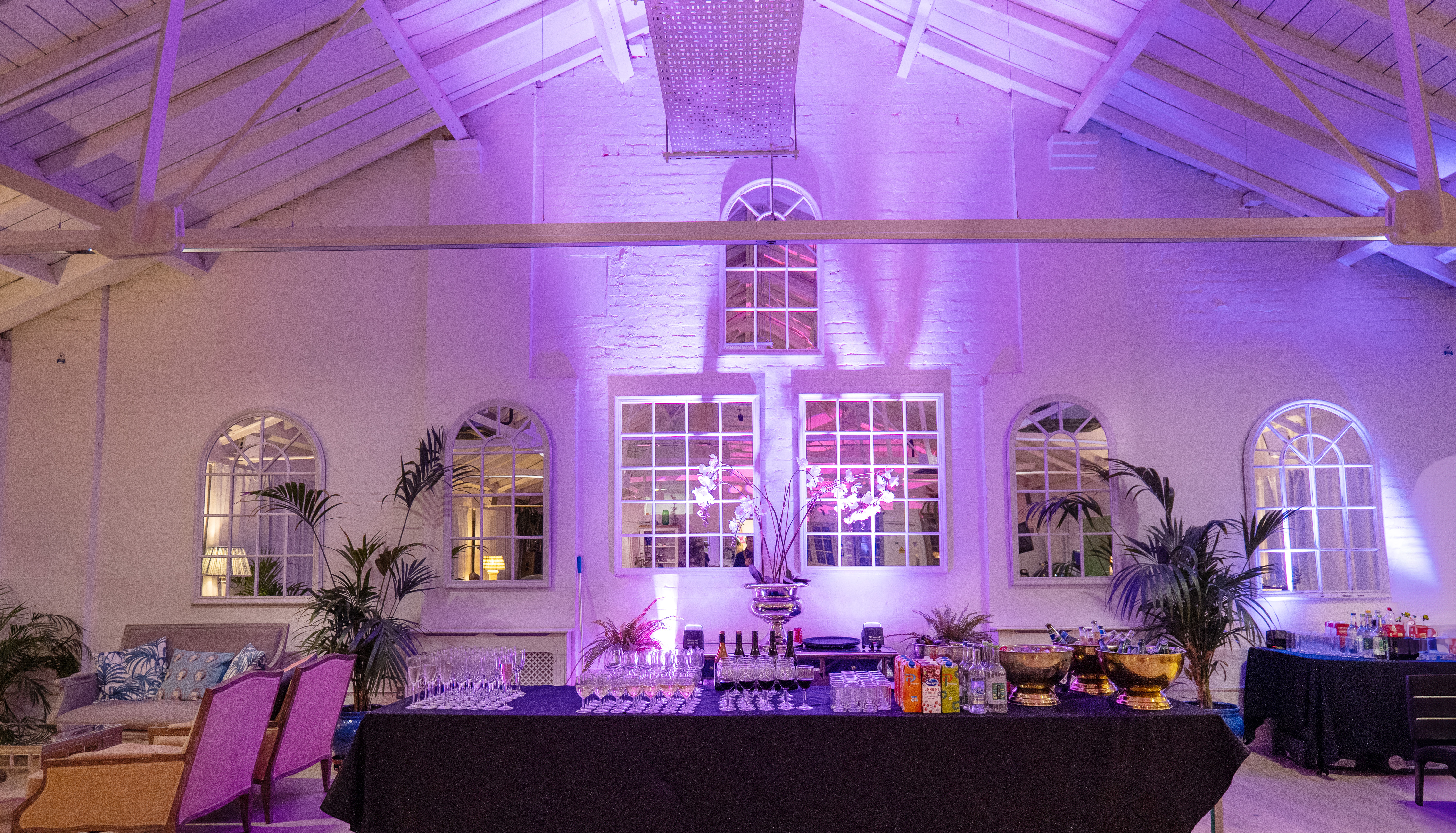 Elegant event space with high ceilings, ideal for social gatherings and corporate events.