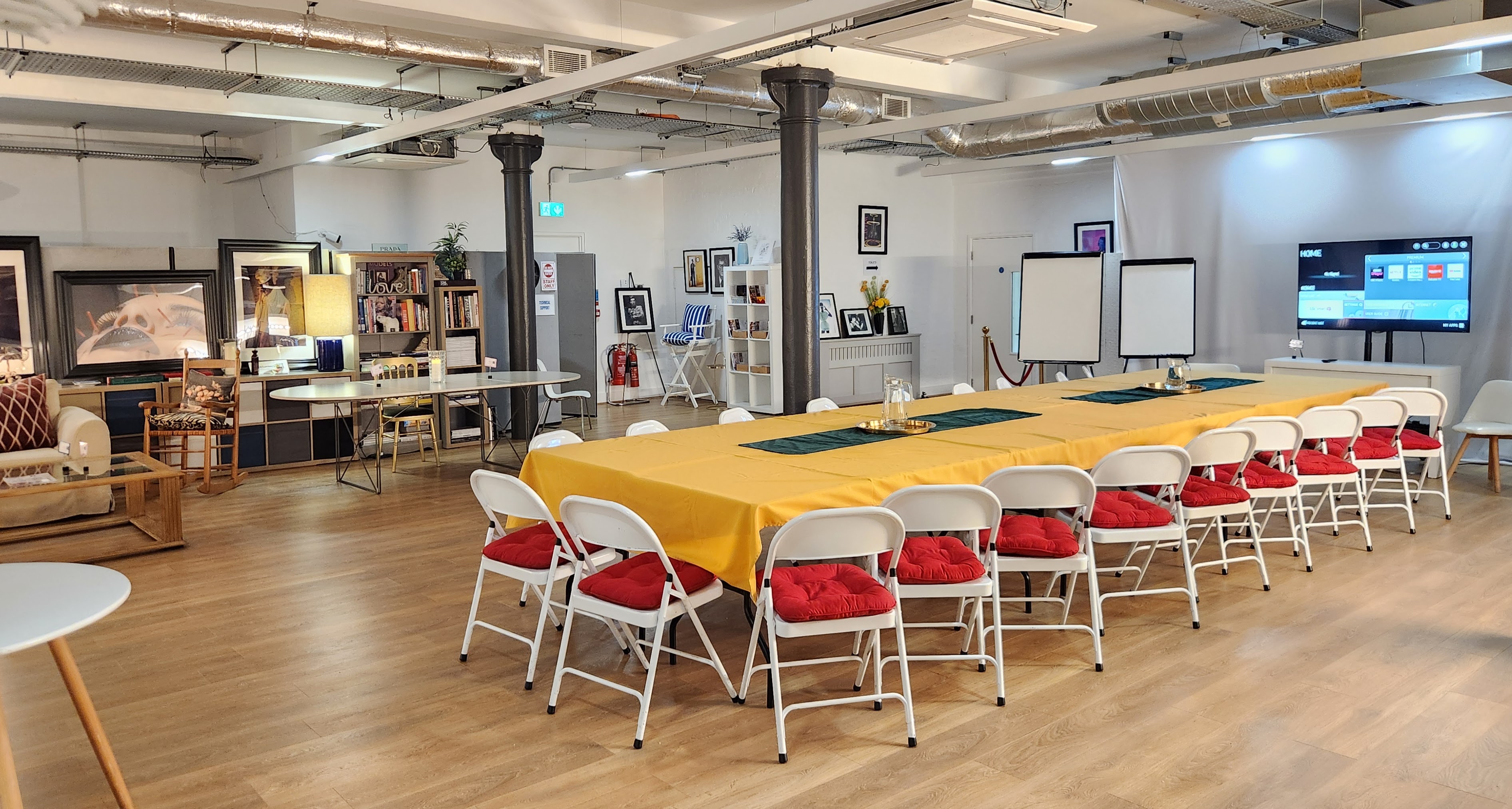La Galeria meeting space with yellow tablecloth, ideal for workshops and team-building events.